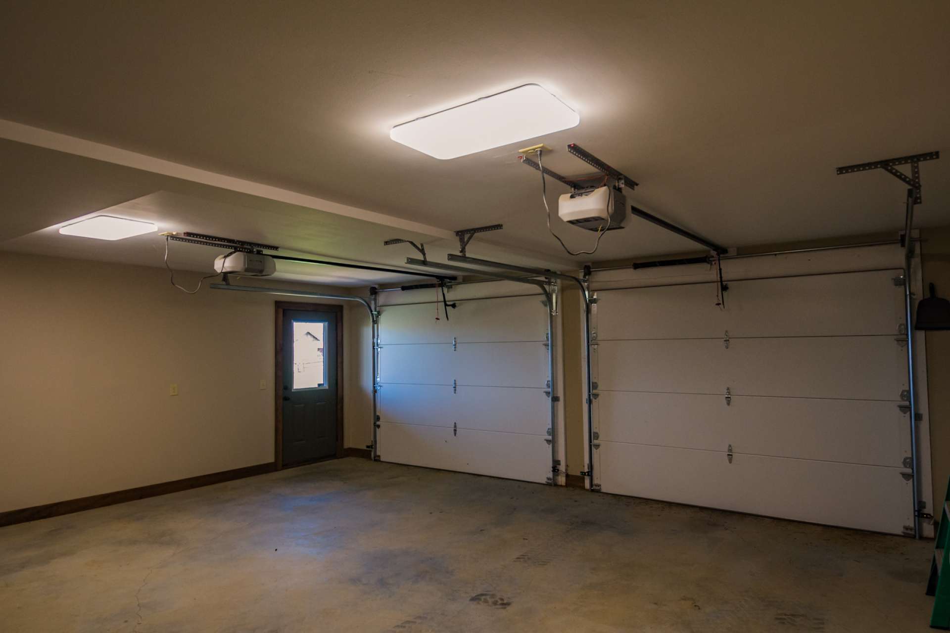 An oversized two-car garage completes the lower level.