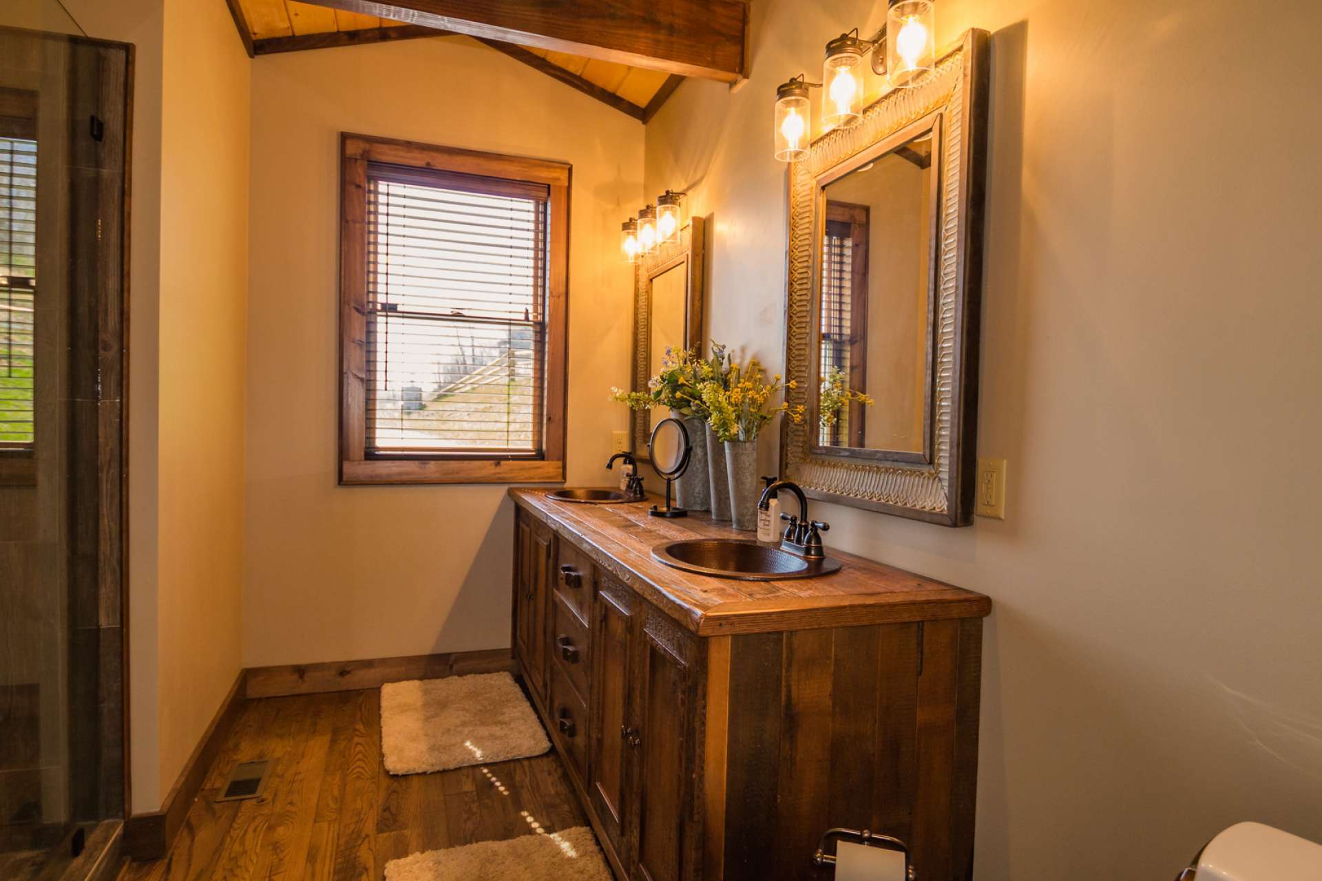 The master bath offers a walk-in tiled shower and a double vanity.  Also notice the architectural accents.