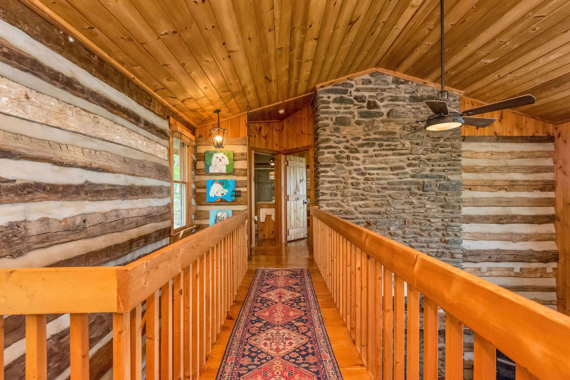 Catwalk takes you to the bonus room with a barn door and separate loft with a tree house view.
