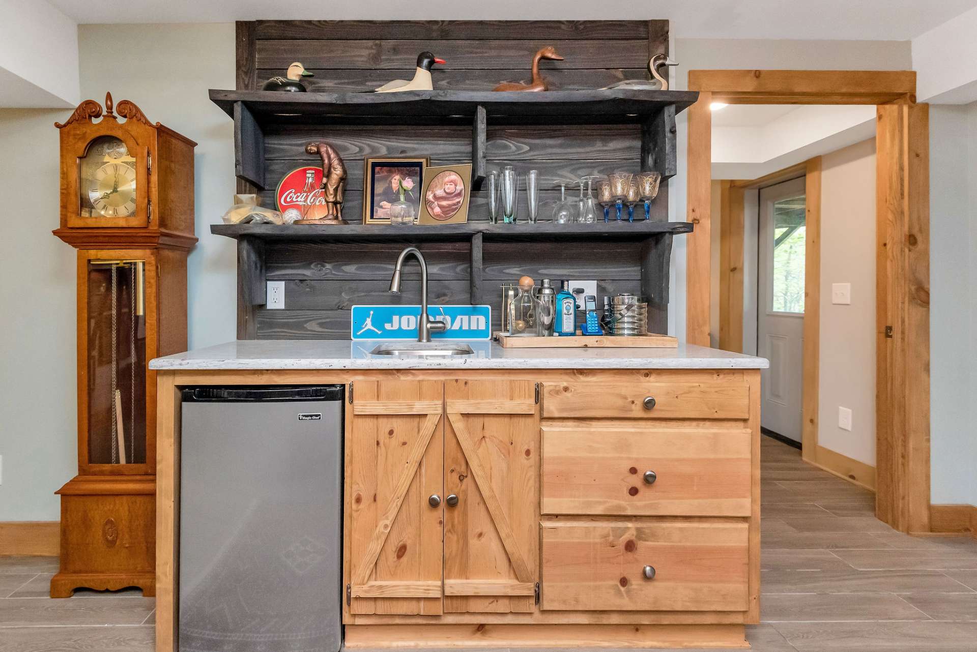 No need to climb the stairs with your convenient wet bar with built-in mini fridge.