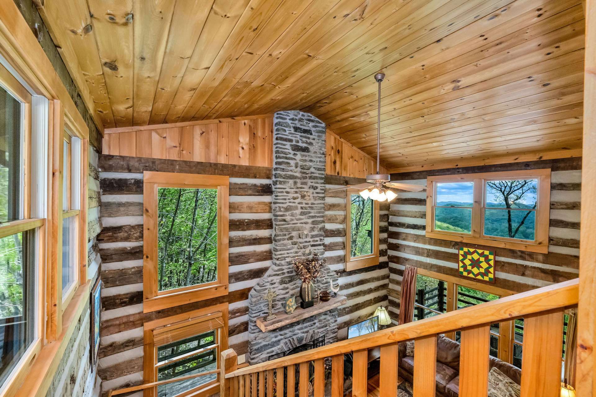 Framing scenic views in every direction, the windows bathe the space in soft, natural light.