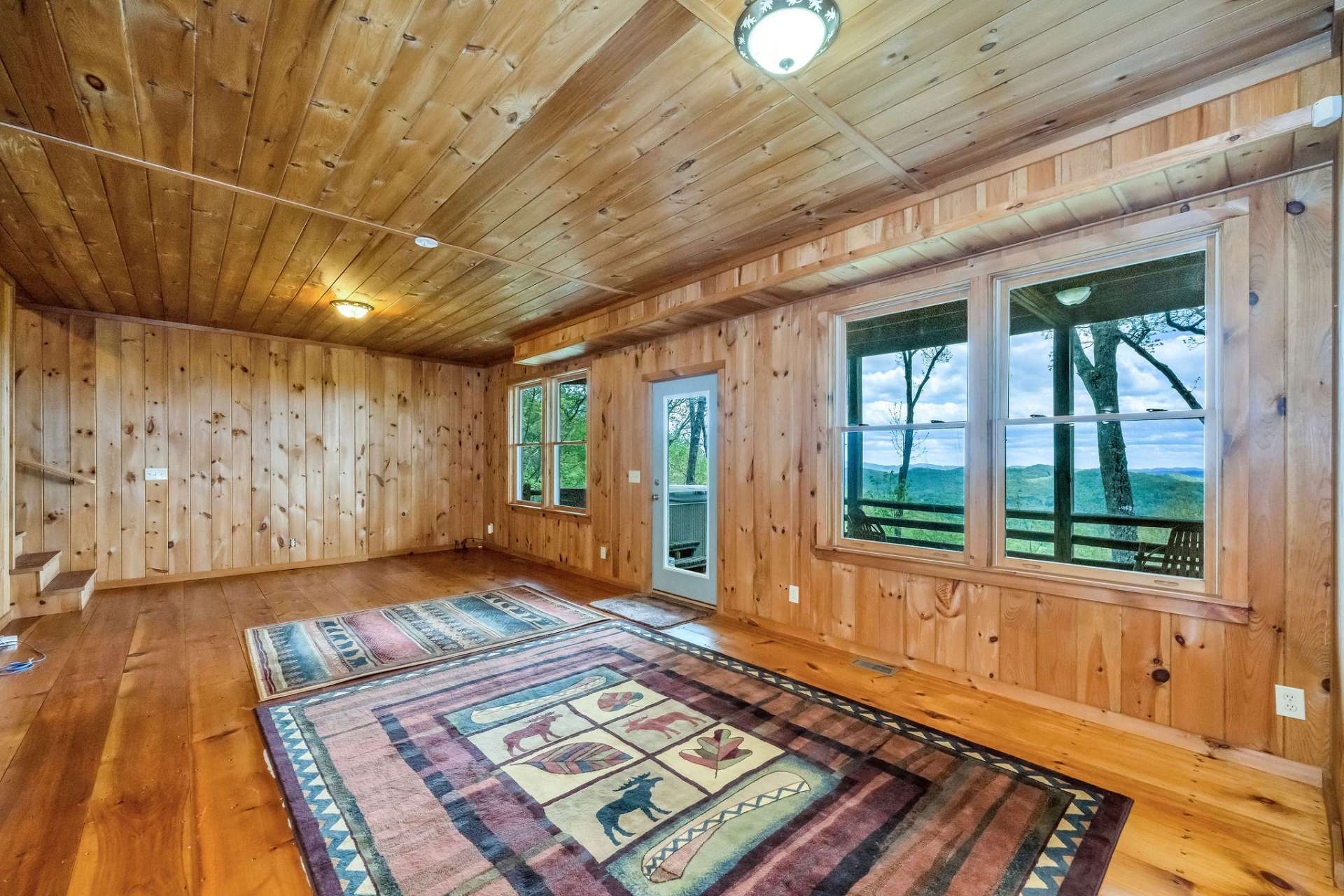 Everyone visiting will enjoy easy access to the lower-level deck with the hot tub.
