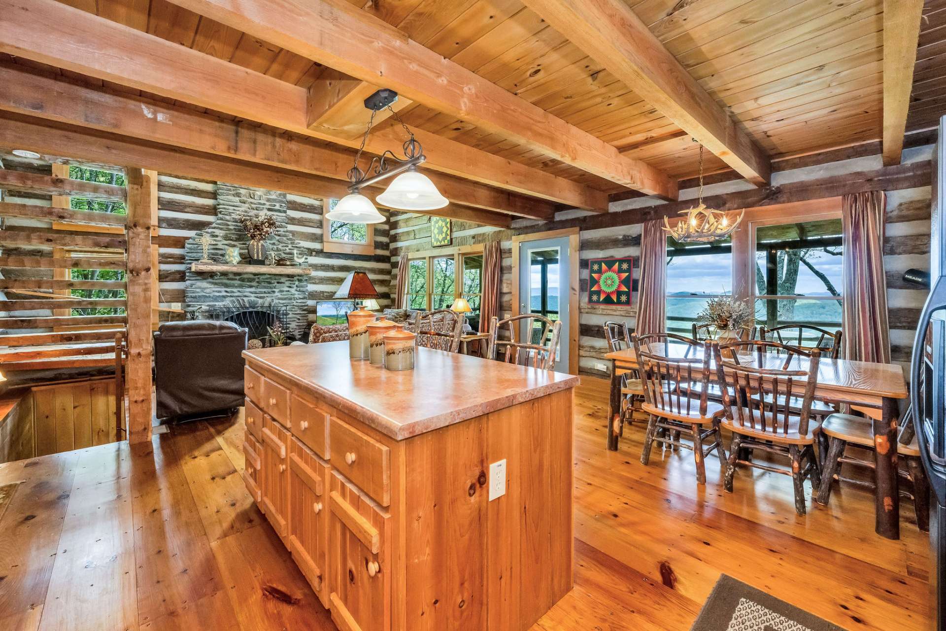 In the heart of the home, the great room harmoniously unites the kitchen, dining, and living spaces—an open invitation to gather, share, and savor the simple joys of mountain living.