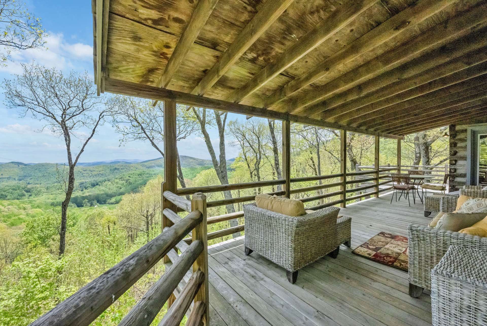 Wrap around porch leads you to where the ridgelines stretch for miles and the horizon feels within reach.