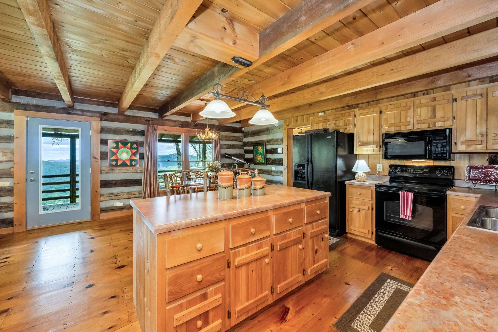 The spacious island invites connection, providing seating, storage, and the perfect spot for the chef to serve and mingle with guests.