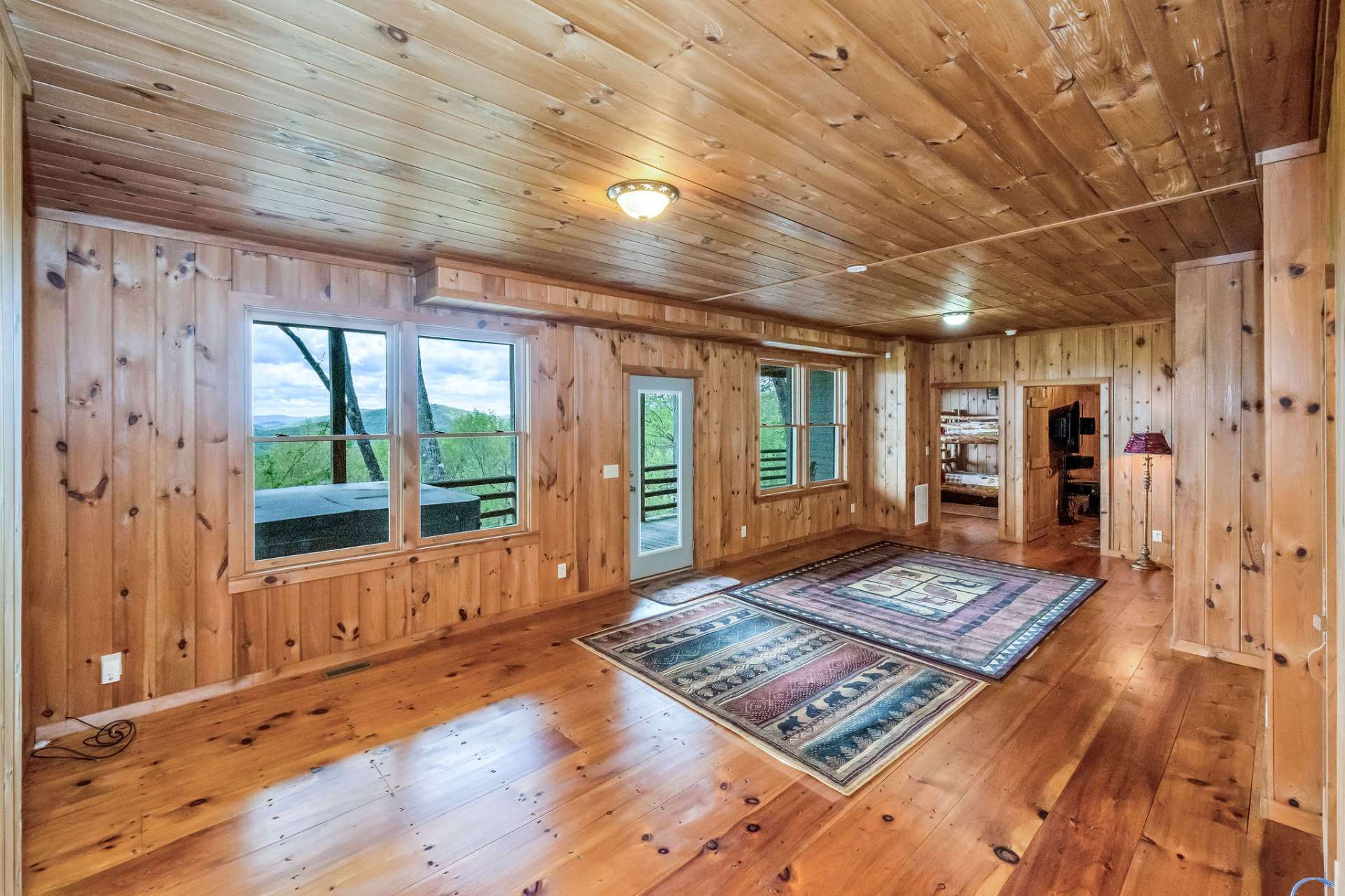 The lower level boasts a beautifully finished family room, offering space to unwind with a casual lounging area and plenty of room for your favorite game table.