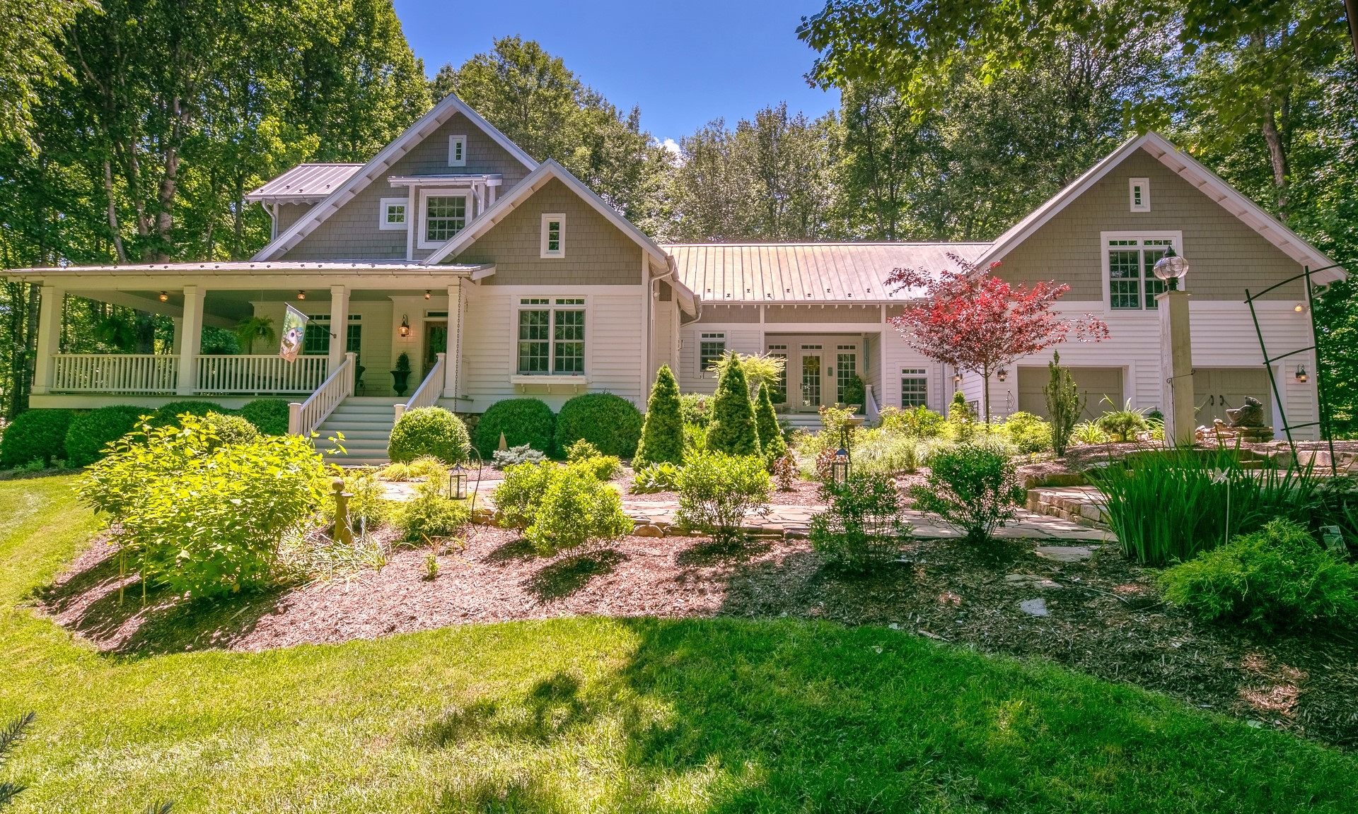LIVE YOUR BEST LIFE HERE in this sprawling modern 4-bedroom, 4.5-bath farmhouse situated on 15.54 acres in The Ridge at Chestnut Hill, a private gated community offering picturesque mountain views and surrounding woodlands.