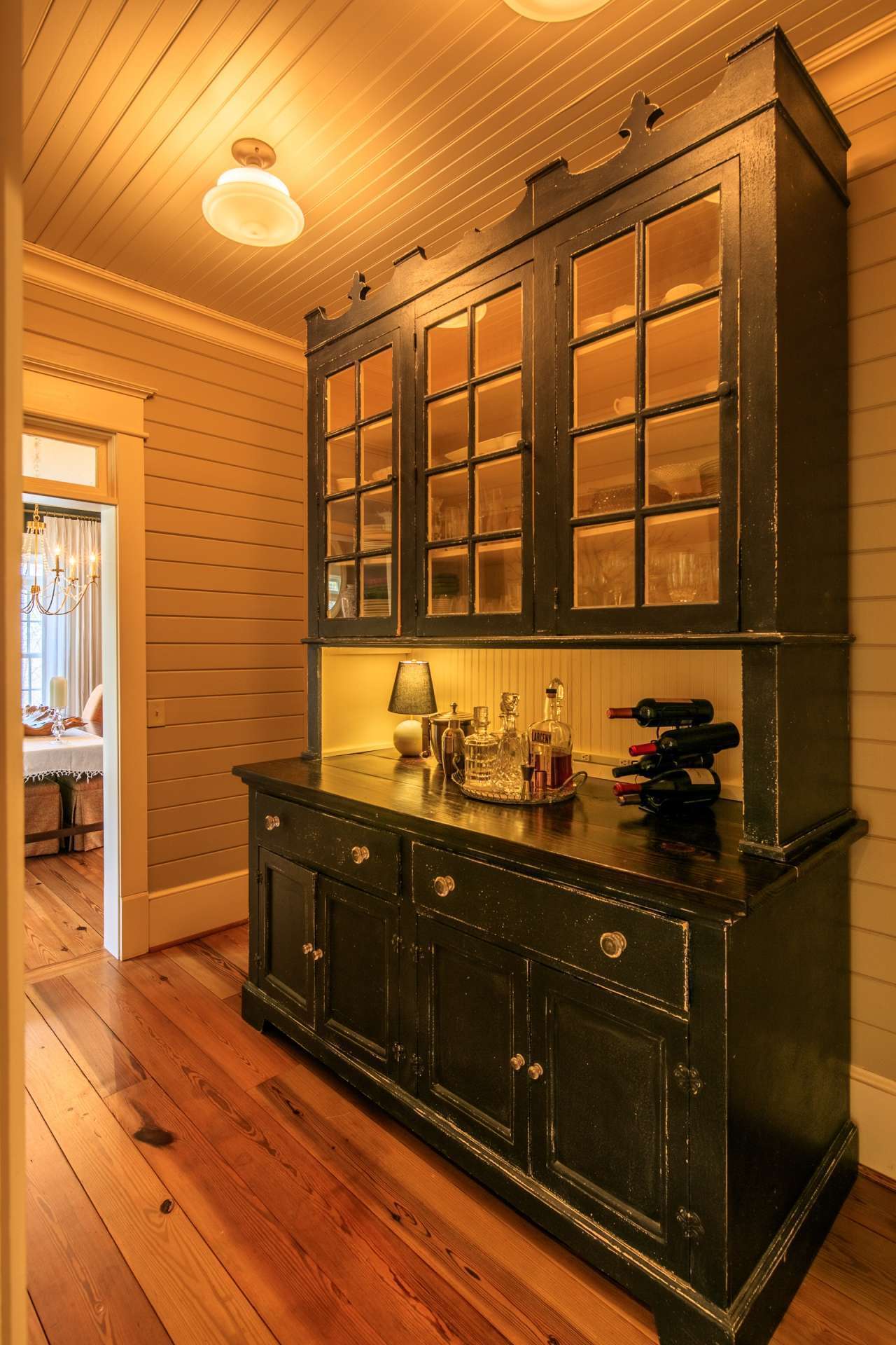 Conveniently located between the kitchen and dining room, the butler's pantry adds additional farmhouse style.