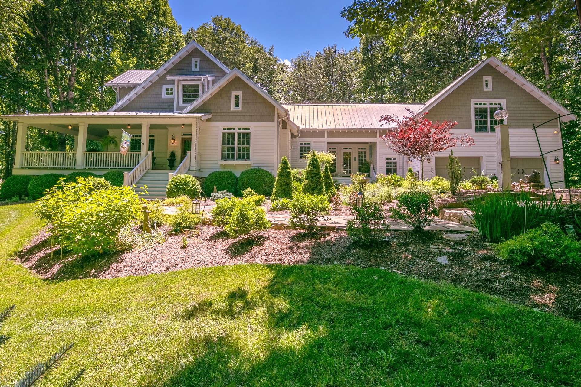 Professional landscaping includes many varieties of shrubbery, perennials and native foliage throughout the four seasons in the NC Mountains.