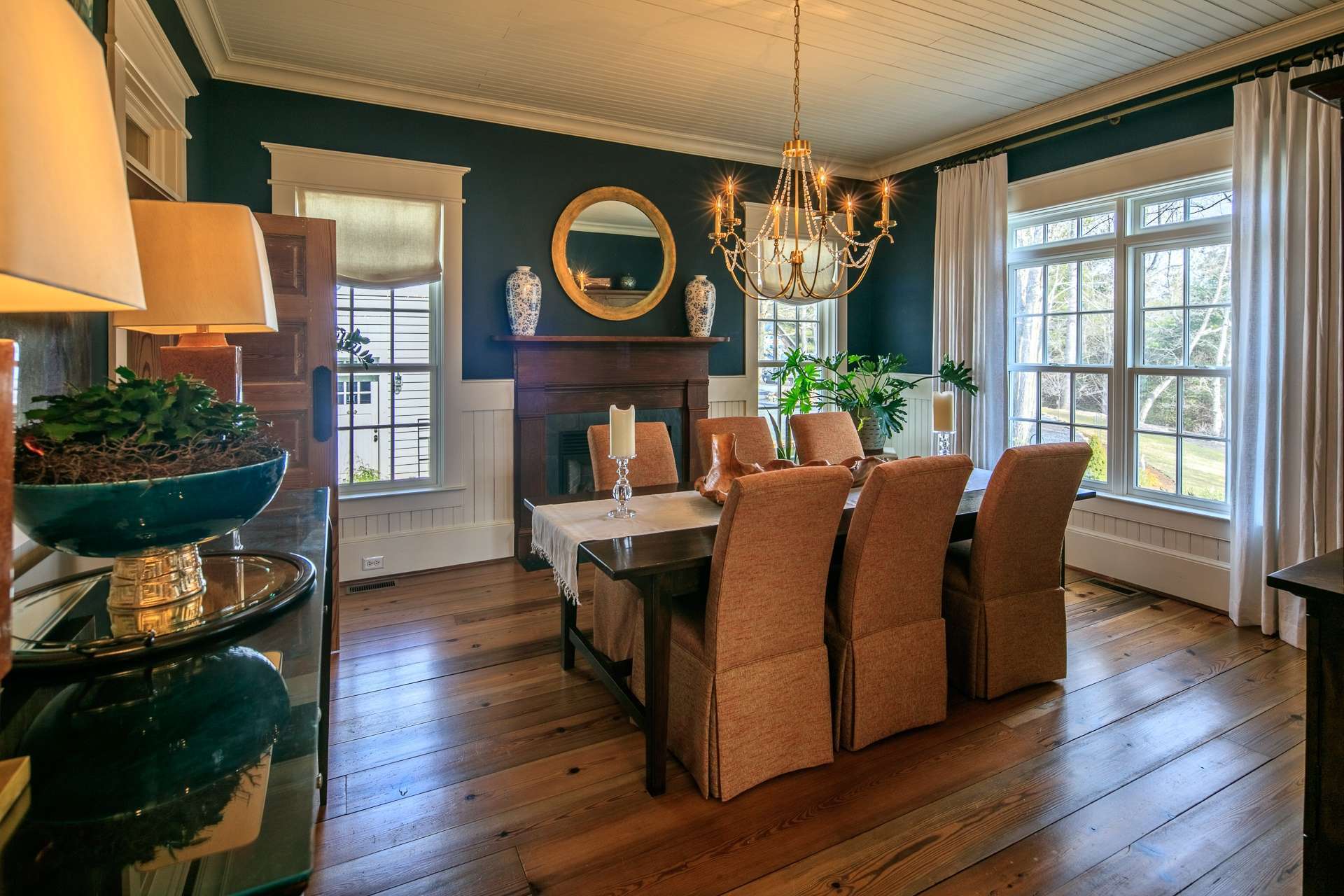 To the right of the entry foyer, is the gracious formal dining room filled with natural light and the third fireplace to enhance the dining experience.