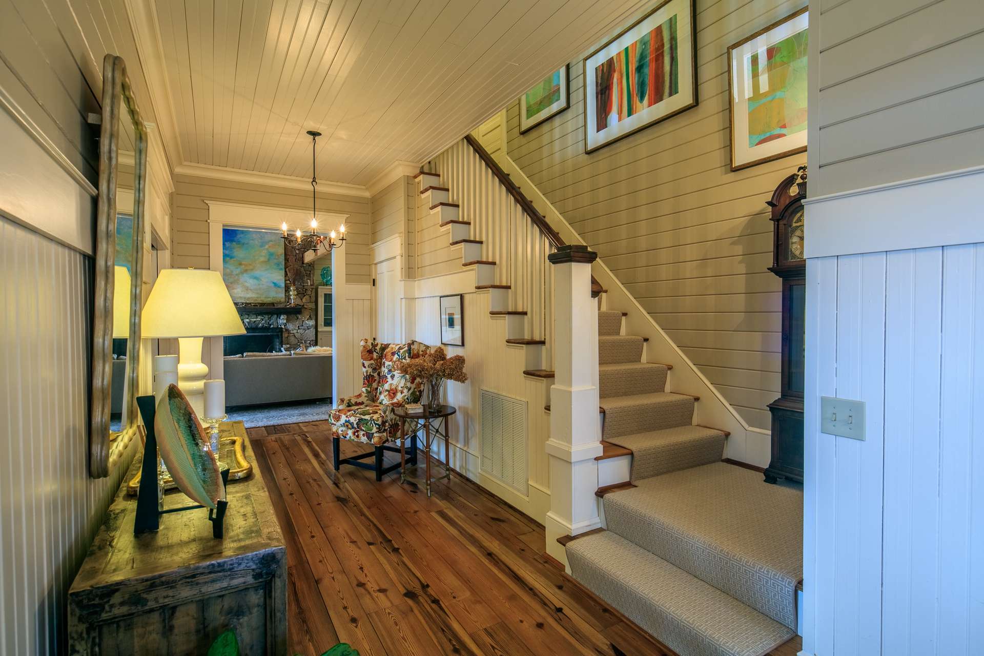 From the front entry foyer, stairs lead to the upper level where you will find two guest bedrooms and two full baths.