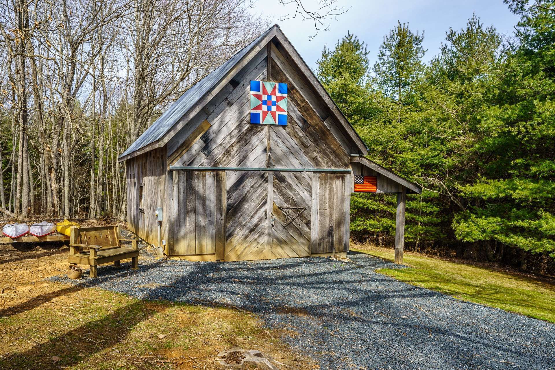This unique barn was built from reclaimed chestnut wood, offers a concrete floor, insulation and electricity, and serves nicely as a workshop and storage space for lawn and garden equipment, canoes, kayaks or other mountain toys.