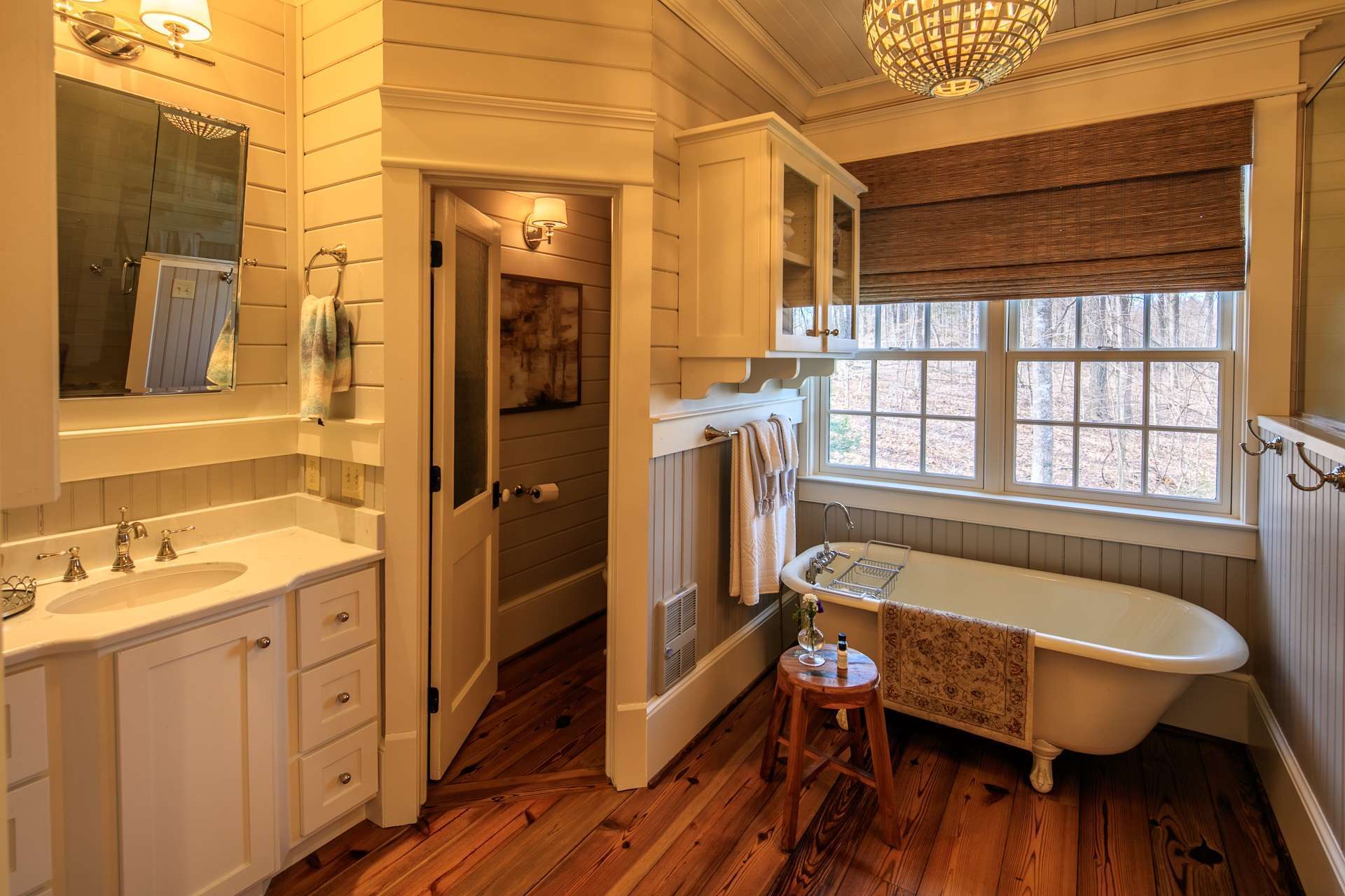 The private master bath features the farmhouse clawfoot soaking tub, an elegant walk-in shower and Jack and Jill vanities.