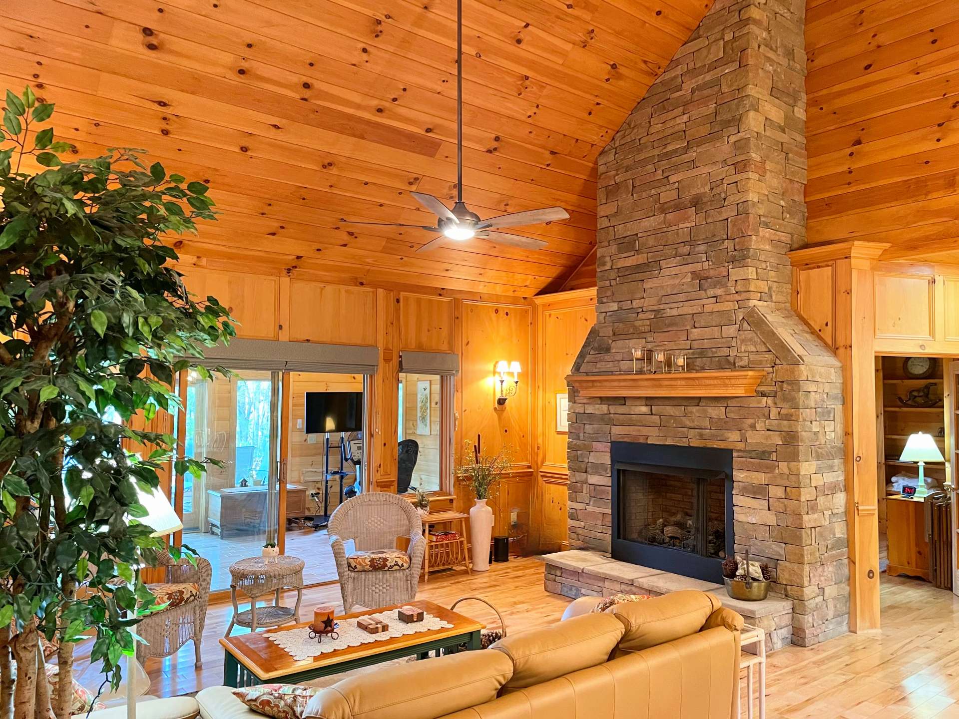 Living area with floor to ceiling stone fireplace with gas logs to warm you on cold nights!