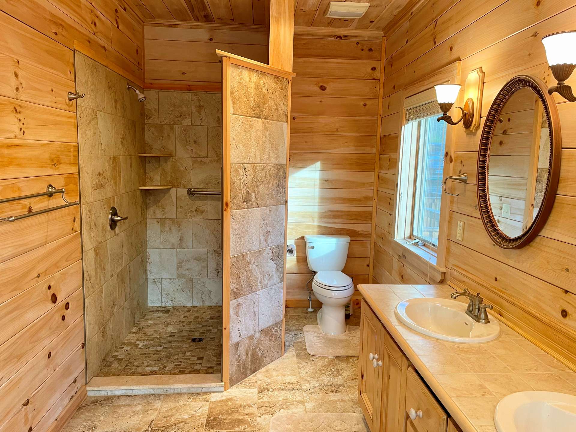 Recently remodeled primary bath with heated floors and walkout shower.