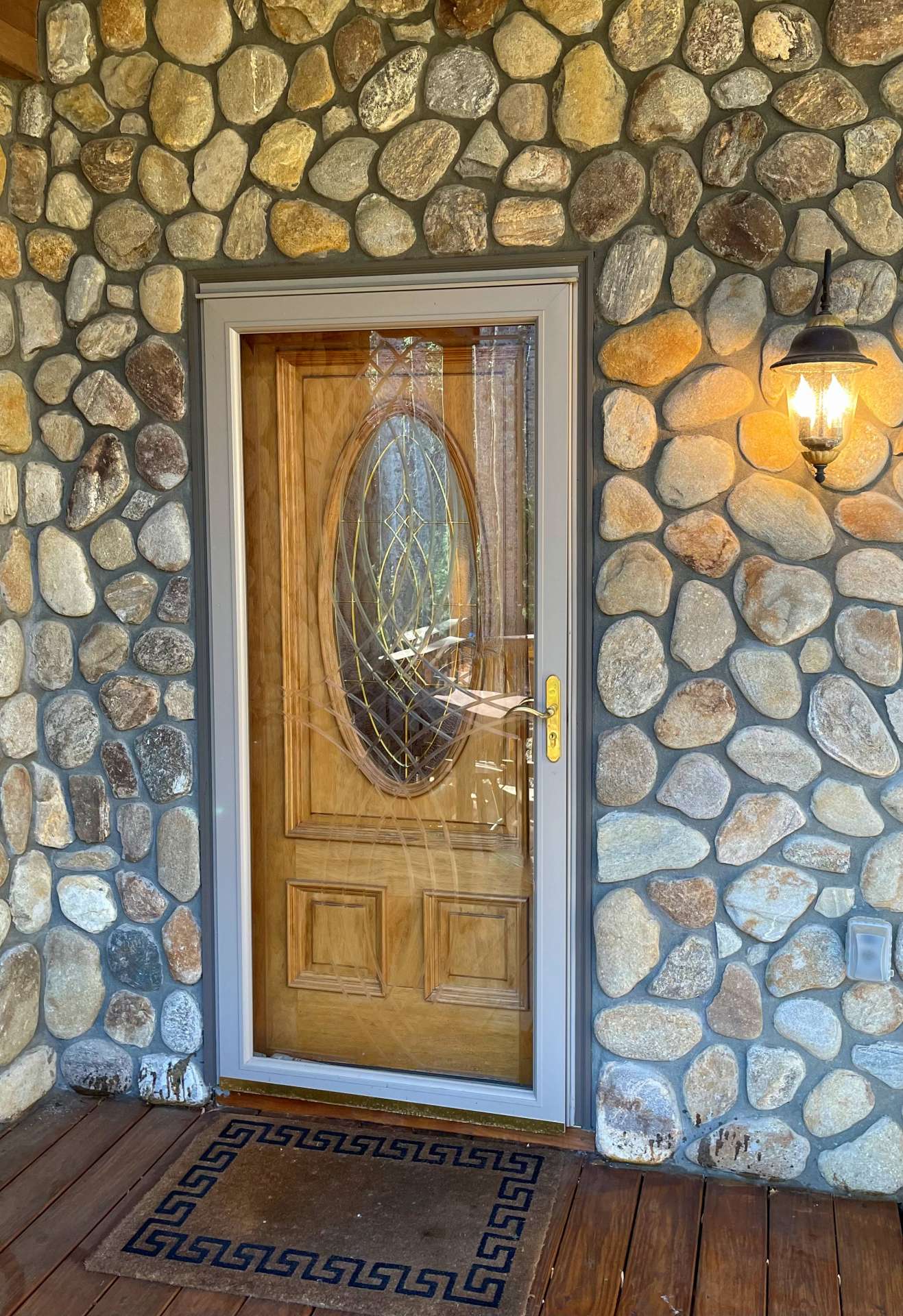 River rock accents on the front porch and main entry.