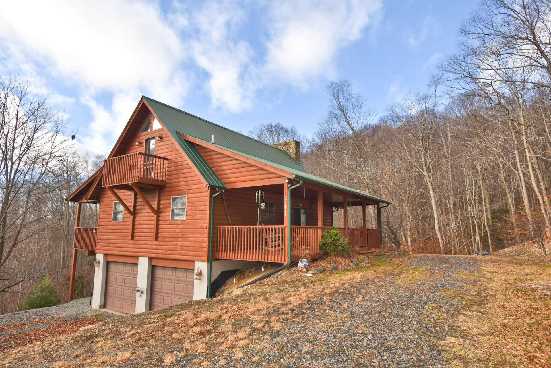 Nestled in the middle of this wonderland is a charming cabin with 2 bedrooms, 2-baths, gorgeous oak flooring, stone fireplace, basement with 2-car garage and expansion possibilities and large covered front and back porches to relax and enjoy layered long-range views.