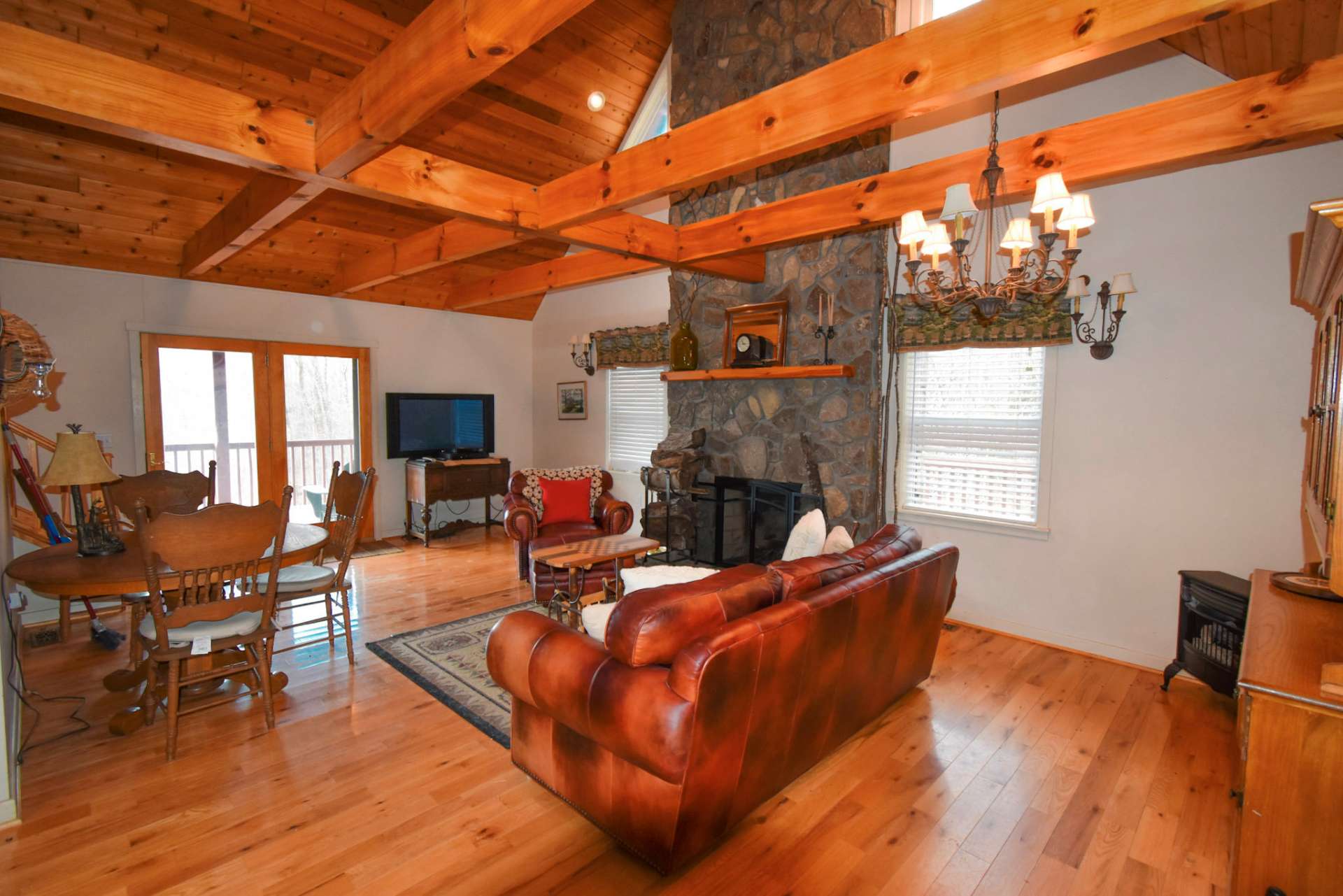 Relax in front of a crackling fire from this floor to ceiling stone fireplace in the great room. There is also a gas log stove for added comfort. With approximately 1,152 heated square feet of living space, this home is ideal for a private mountain get-a-way.