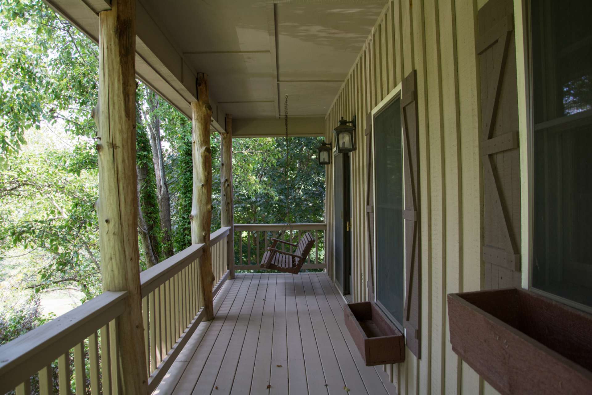 Enjoy multiple outdoor spaces including this covered front porch, upper level balcony, covered side porch, and lots of open outdoor space.