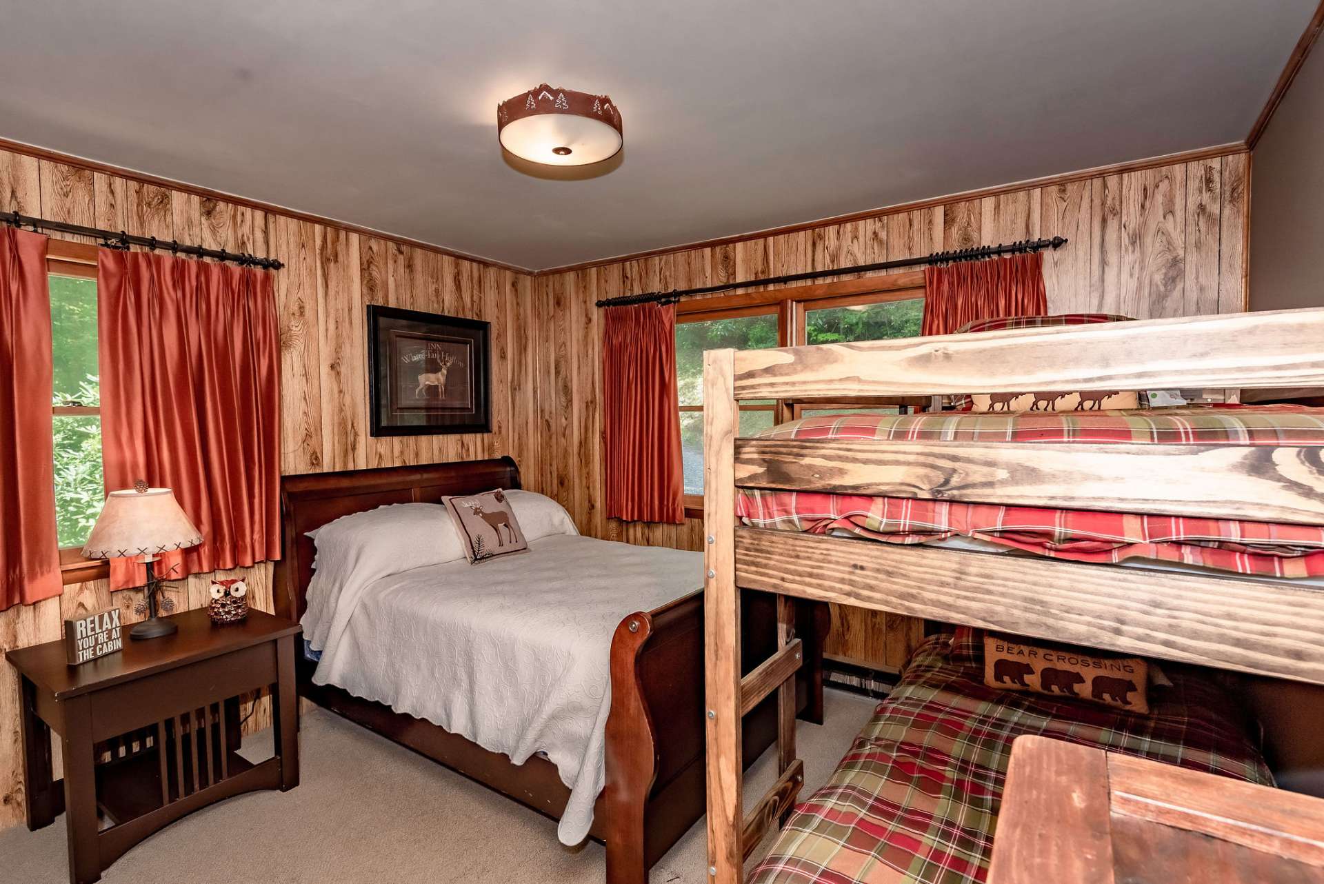 This is the second main level bedroom with plenty of space for a queen bed and a set of bunk beds.