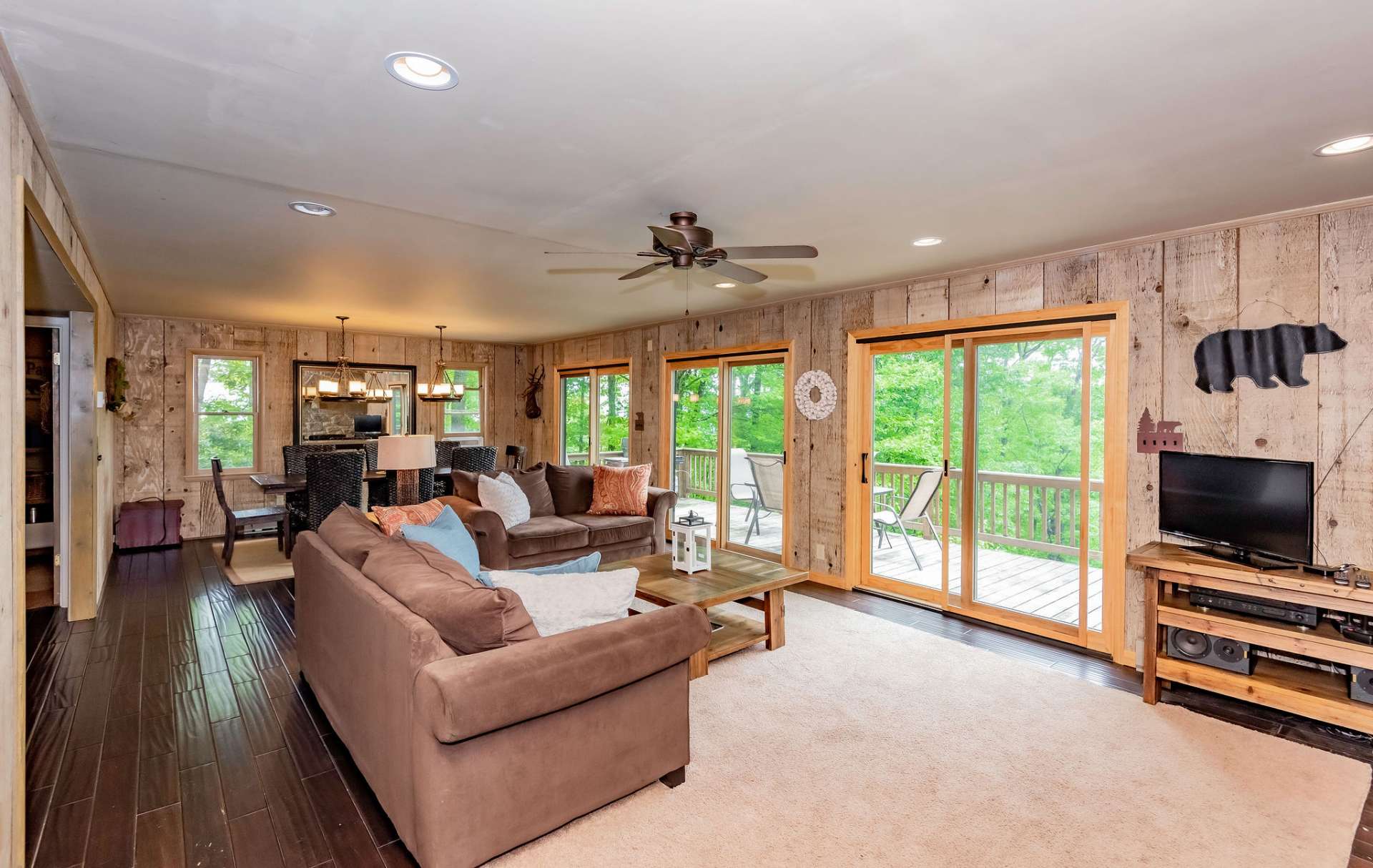 Open to the formal dining area, this space also offers easy access to the back deck for outdoor grilling, dining, and entertaining.