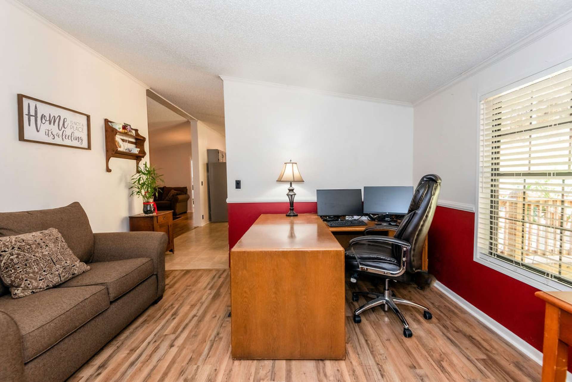 This bonus room is currently used as an office.