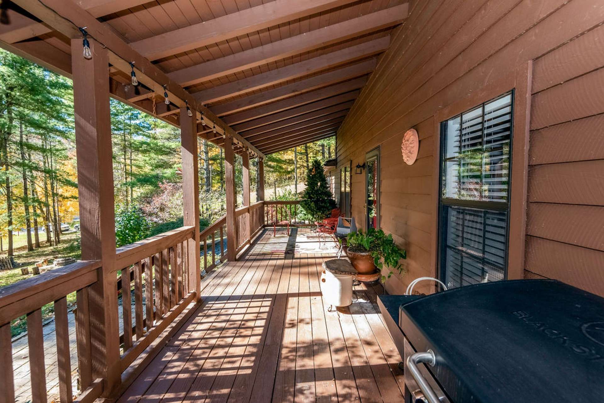 A spacious front porch invites you and guests to relax and enjoy mountain living.