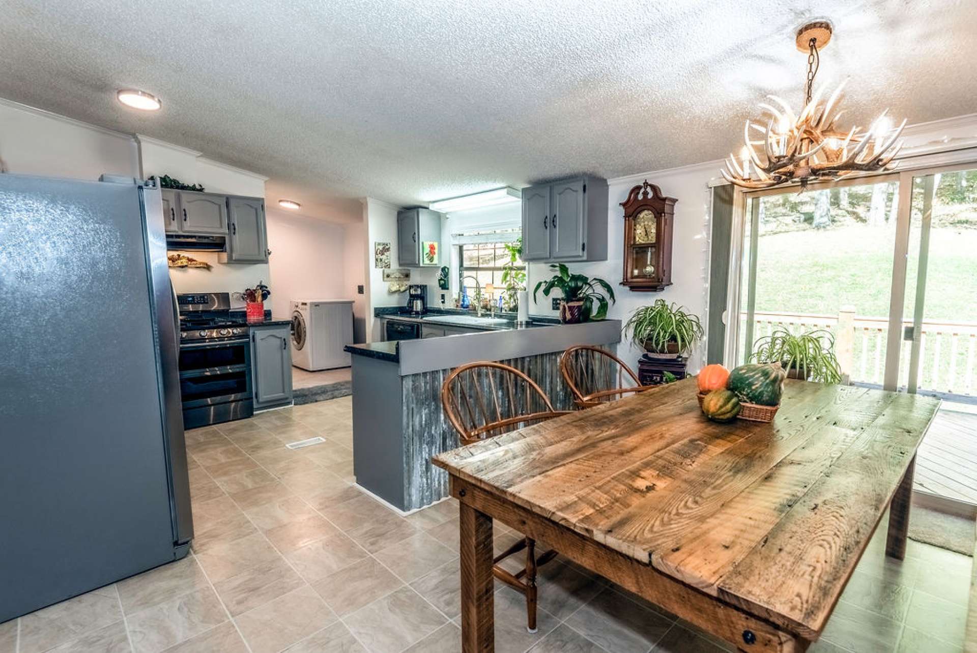 The laundry area is accessed from the kitchen area.