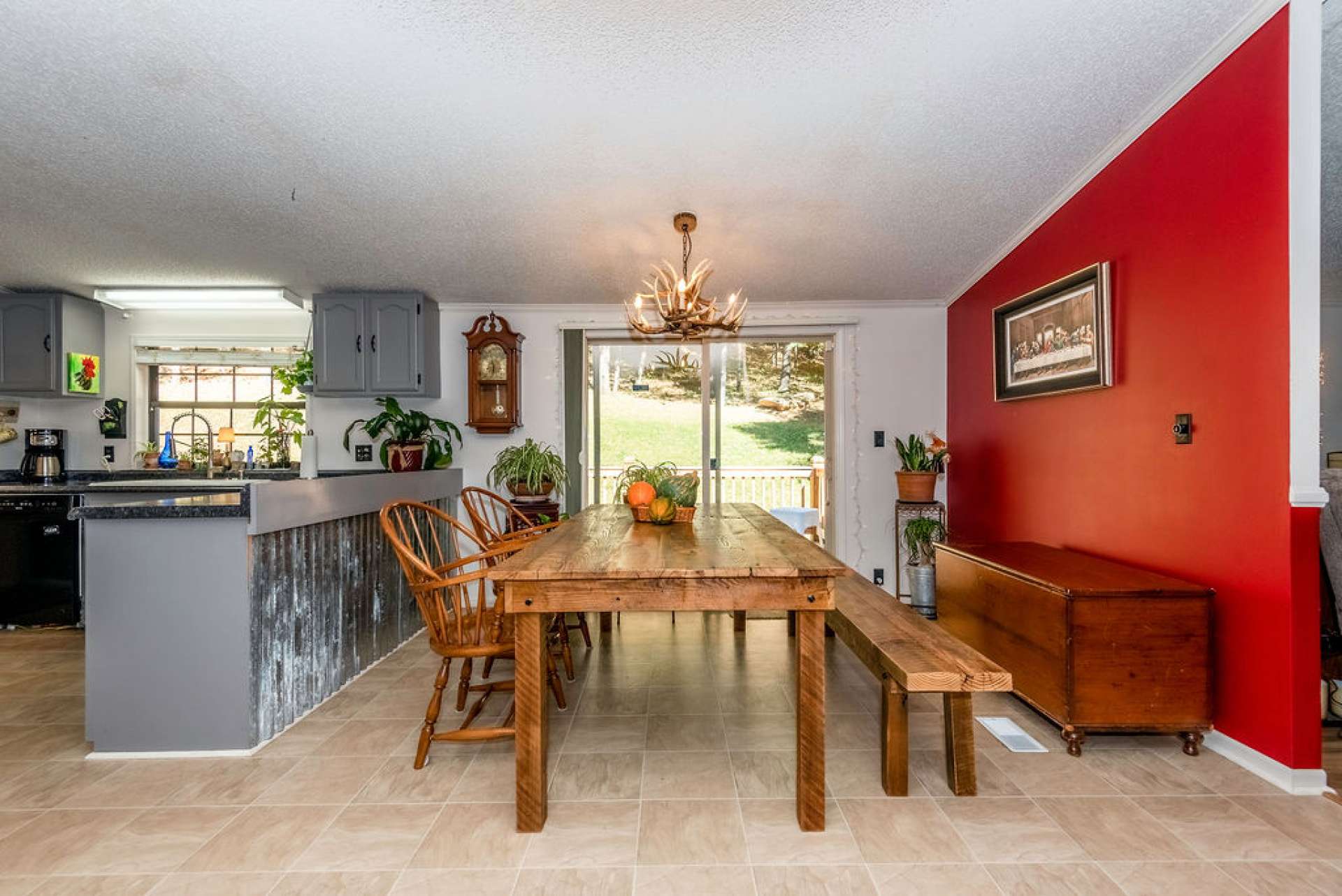 The dining area offers easy access to the back deck for outdoor grilling and dining.