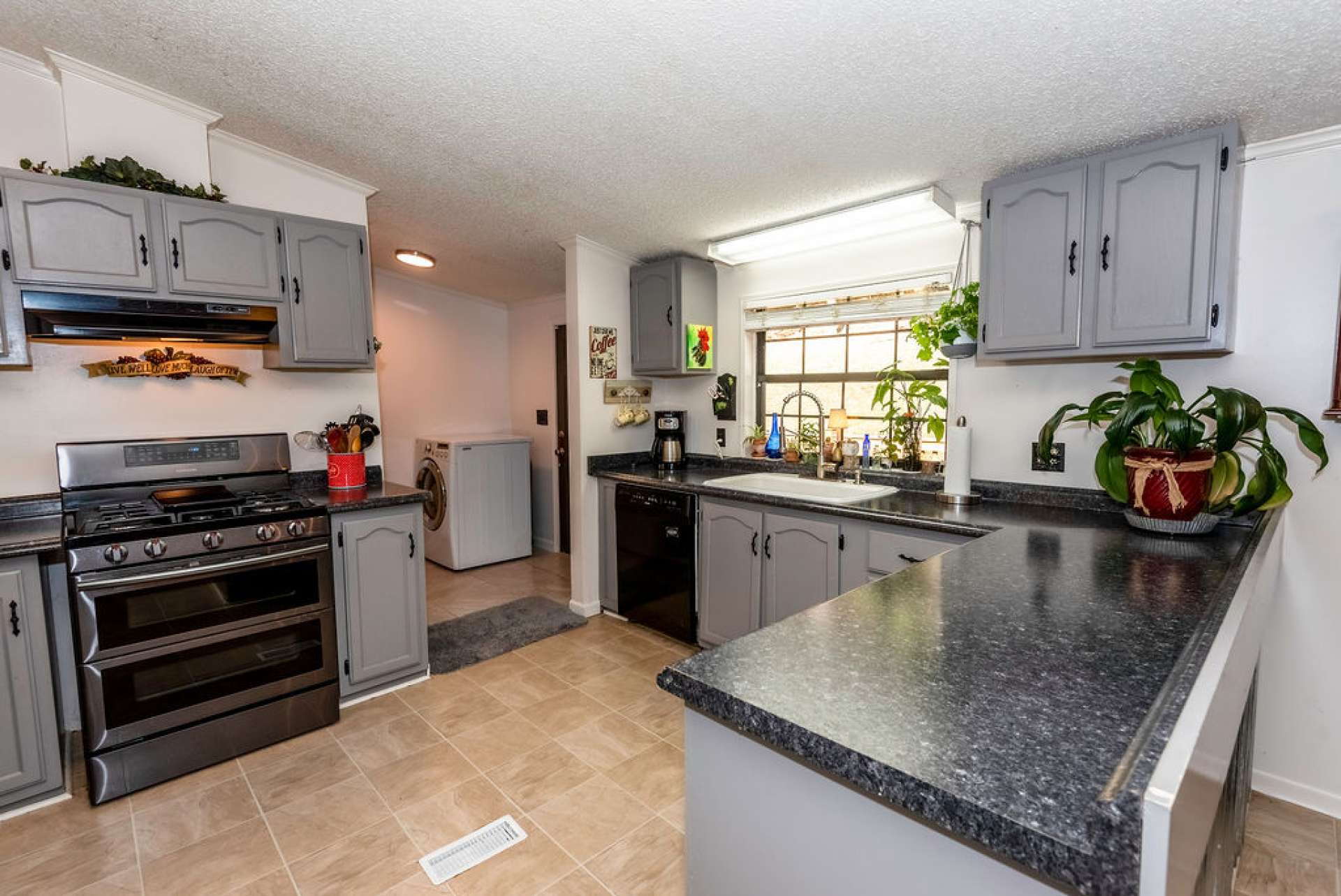 You will love the updated kitchen with gas range, new refrigerator, and new farm sink.
