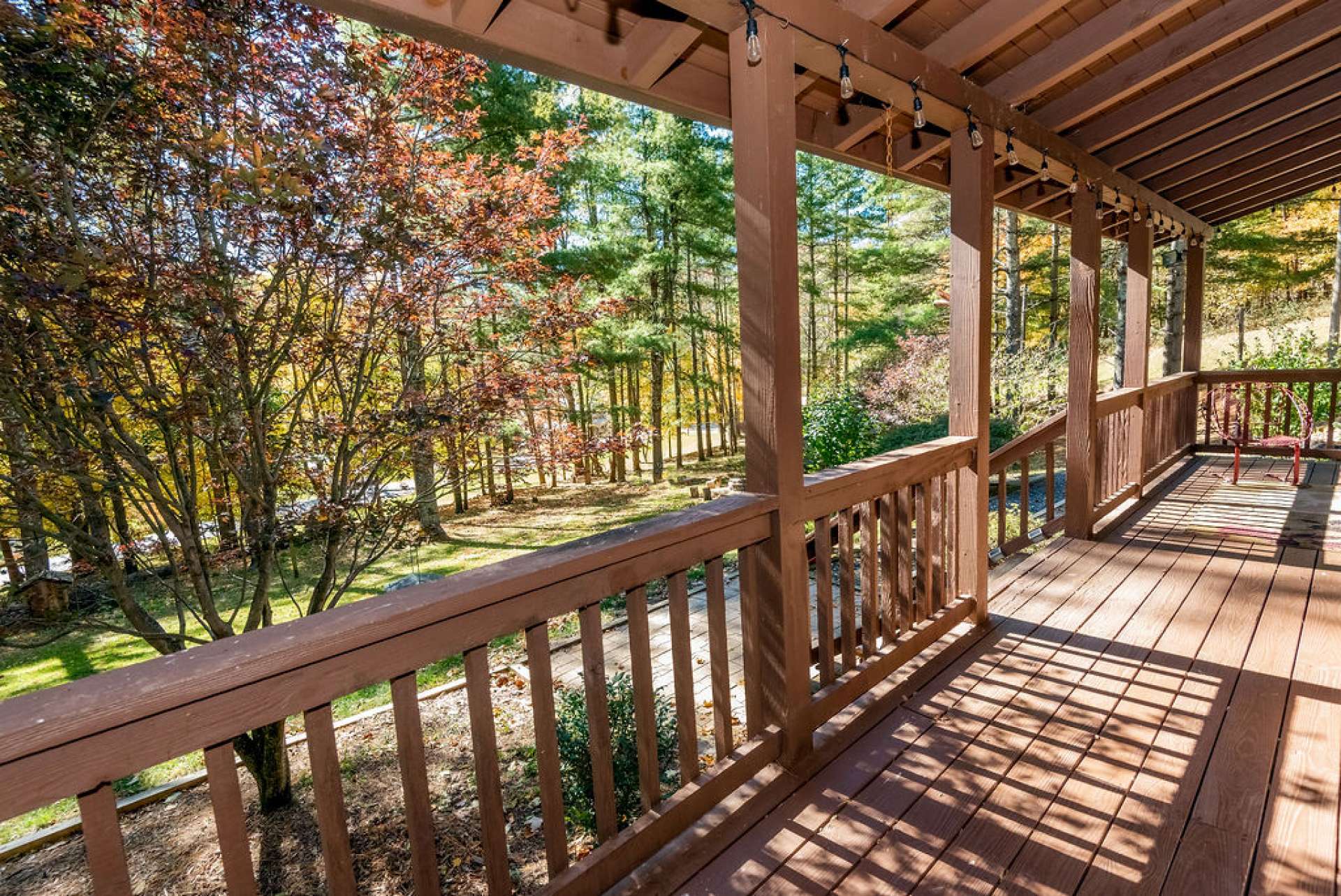 The covered front porch is an ideal space for entertaining friends or simply relaxing with the sounds of Nature.
