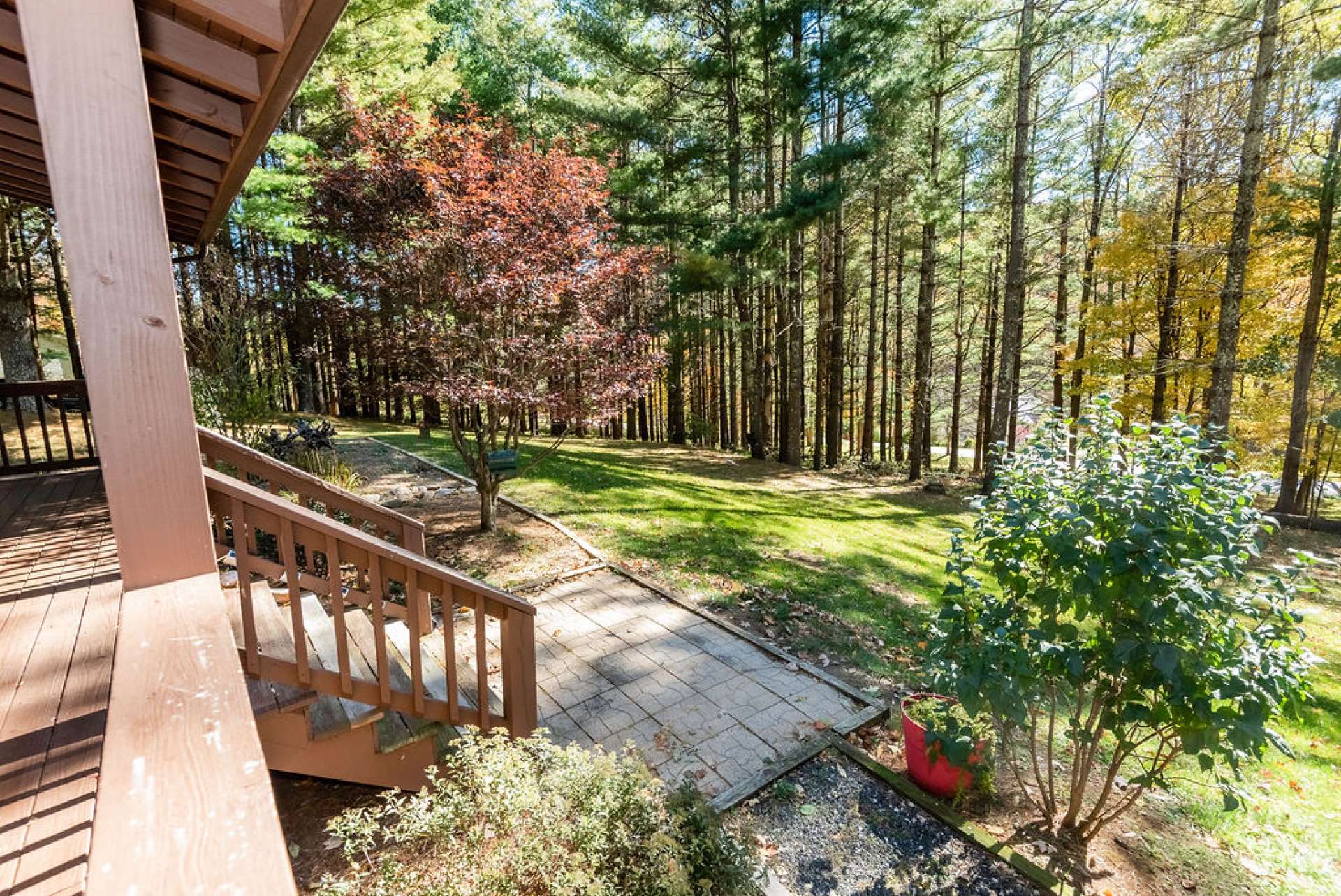 The porch overlooks the beautifully landscaped yard.