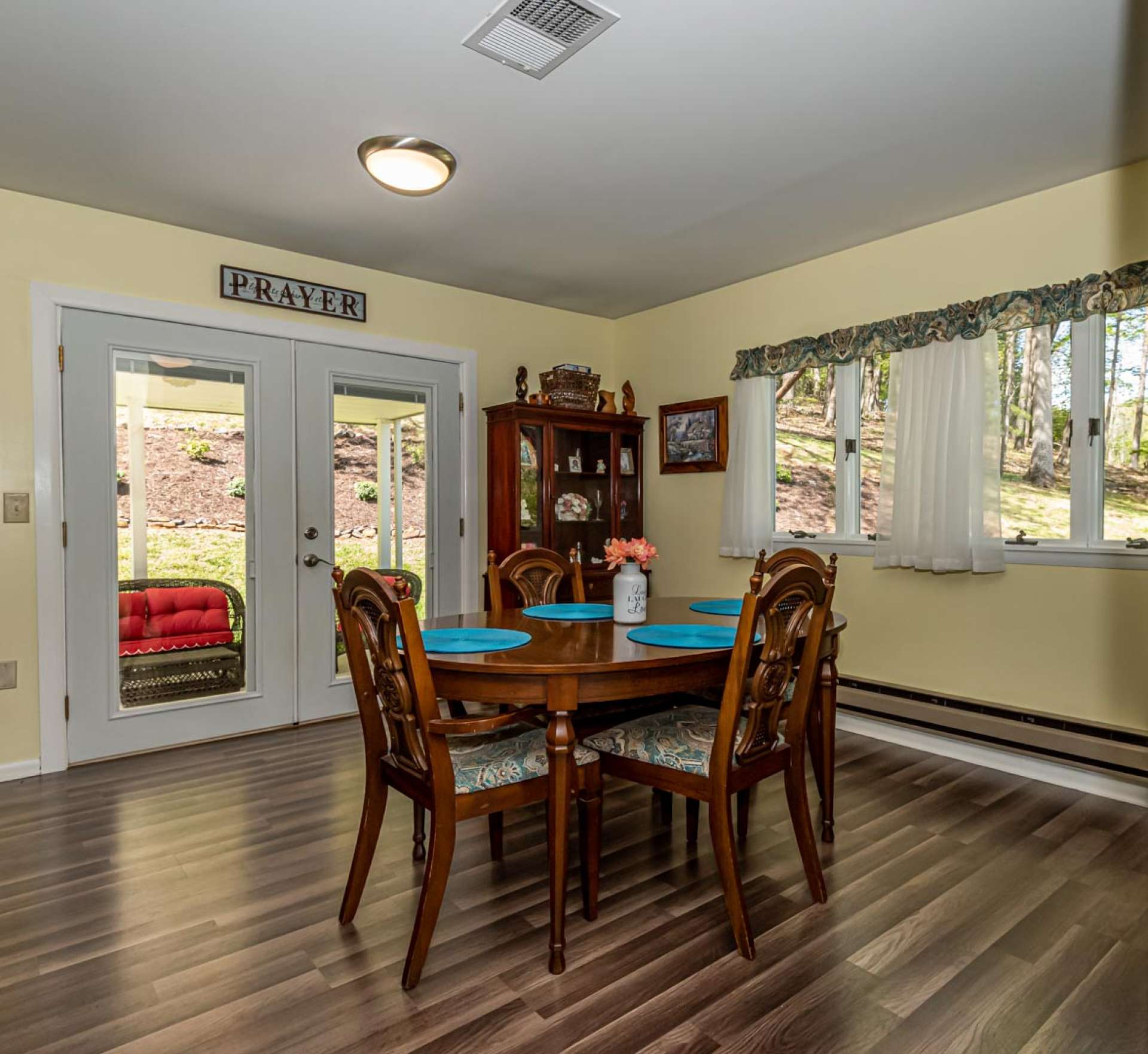 The dining area is light filled and offers outdoor views throughout all four seasons.