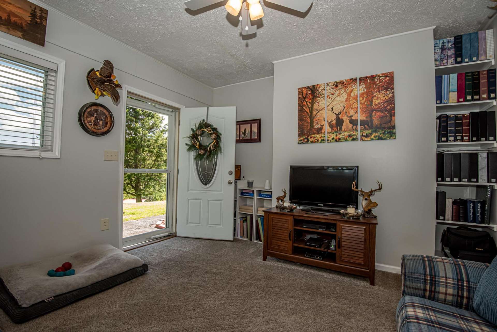 There is also a spacious den/family room that is accessed from outdoors or the dining room.