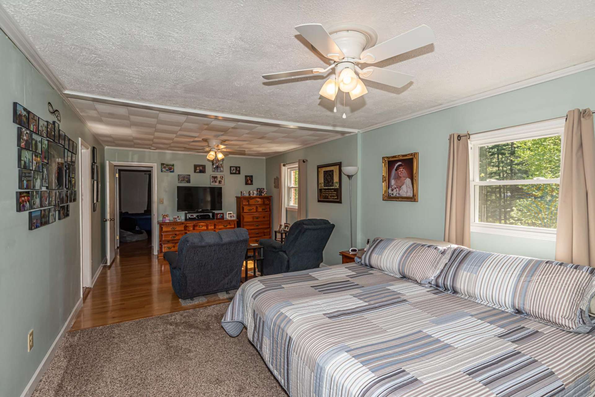 The spacious master suite offers a lounge area for watching TV or reading.