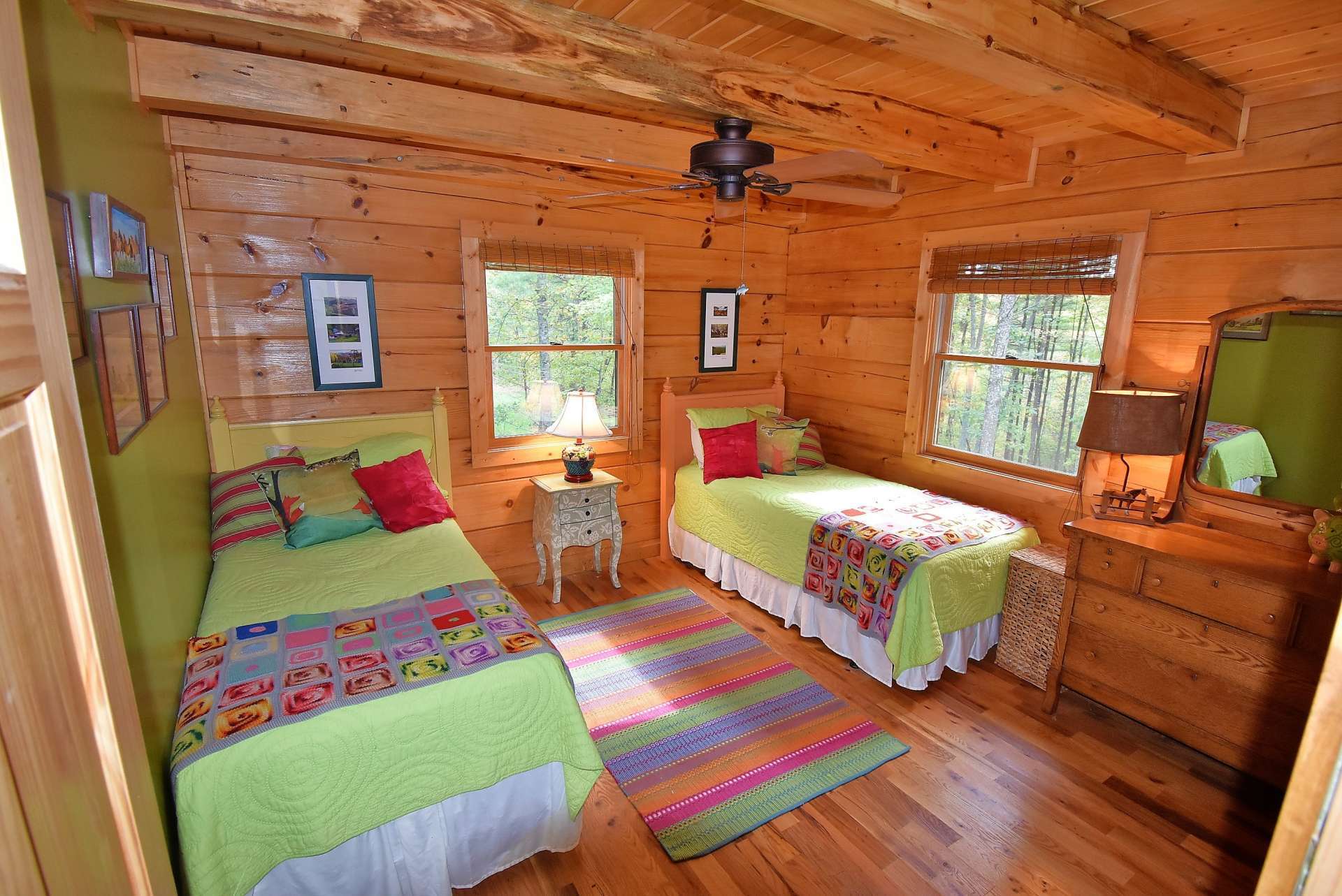 The main level guest bedroom is also spacious with wood floor. Both bedrooms share a full bath.