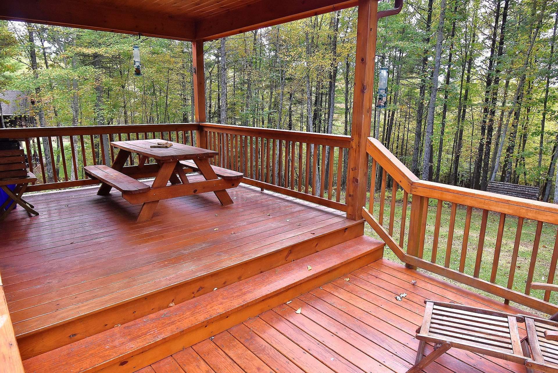 In addition to the covered front porch, this partially covered back deck offers more outdoor entertaining space.