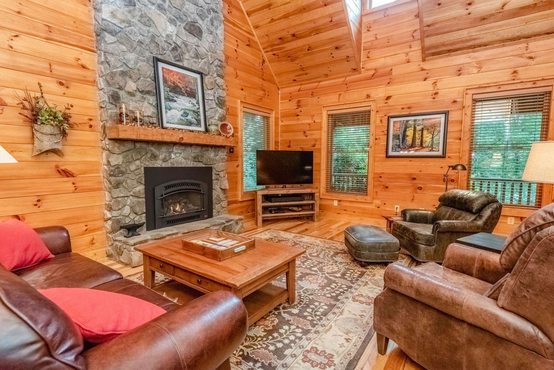 Impressive stone fireplace is the focal point of the living room.