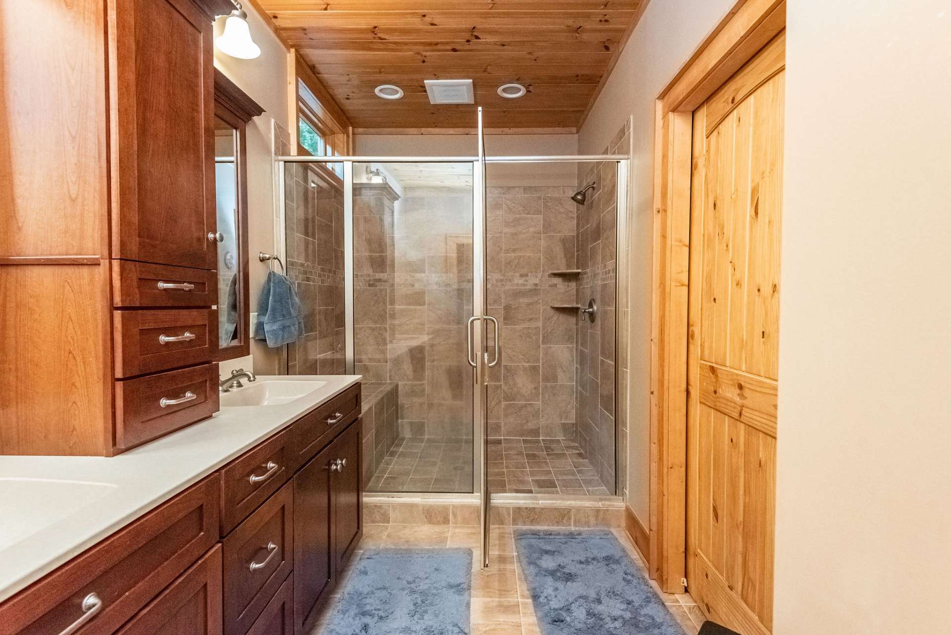 Private master bath with double sinks and an additional closet.