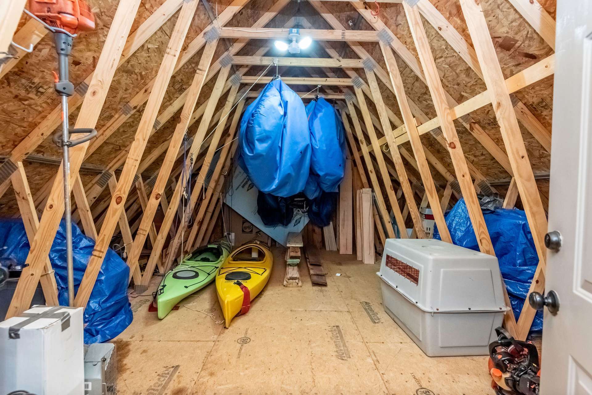 Upper level of outbuilding offers additional storage.