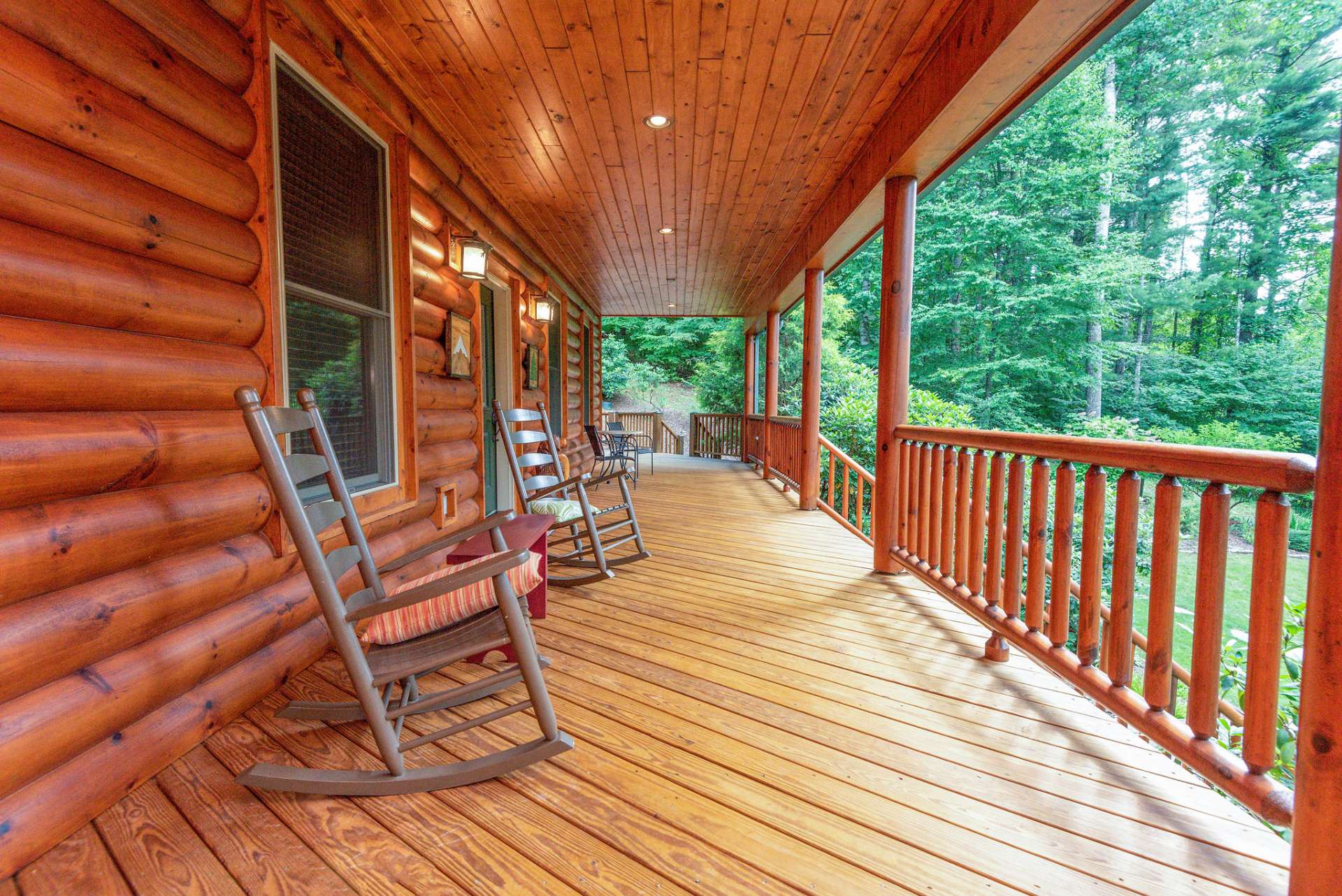 A covered front porch welcomes you and guests to relax with the sounds of Nature and fresh mountain air.