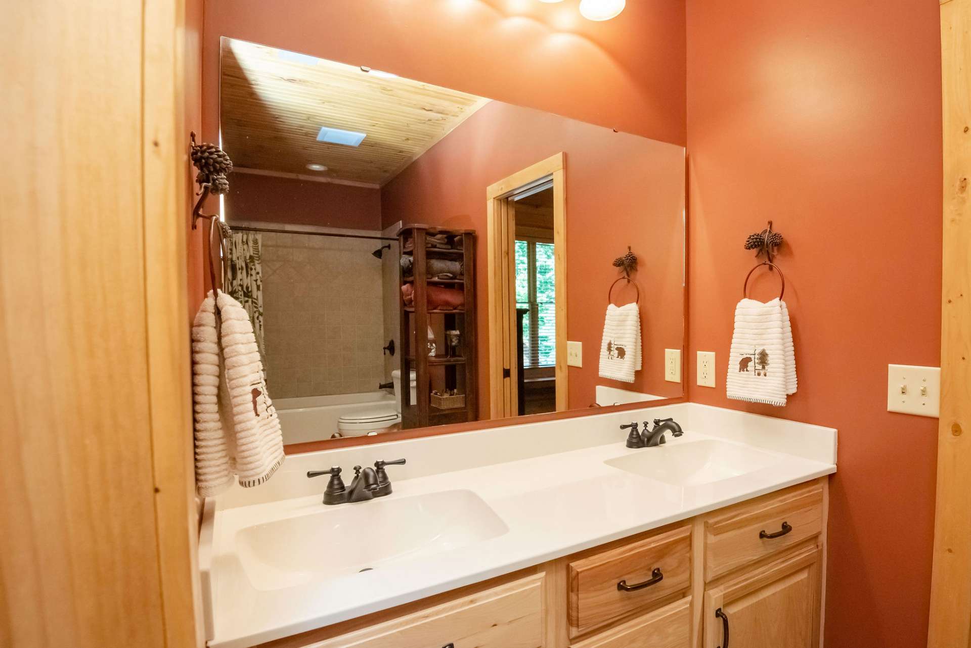 Shared bath with double sinks between the upper level bedrooms.