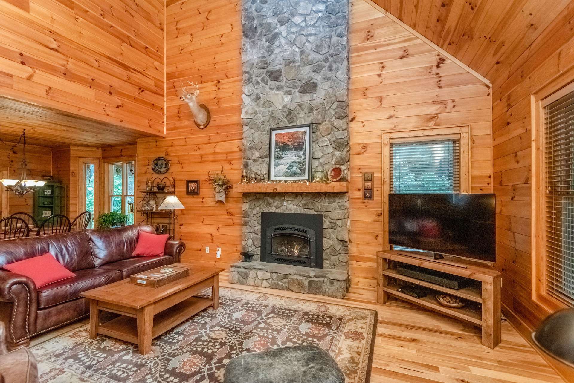 Exquisite cabin offers tongue and groove ceilings throughout.