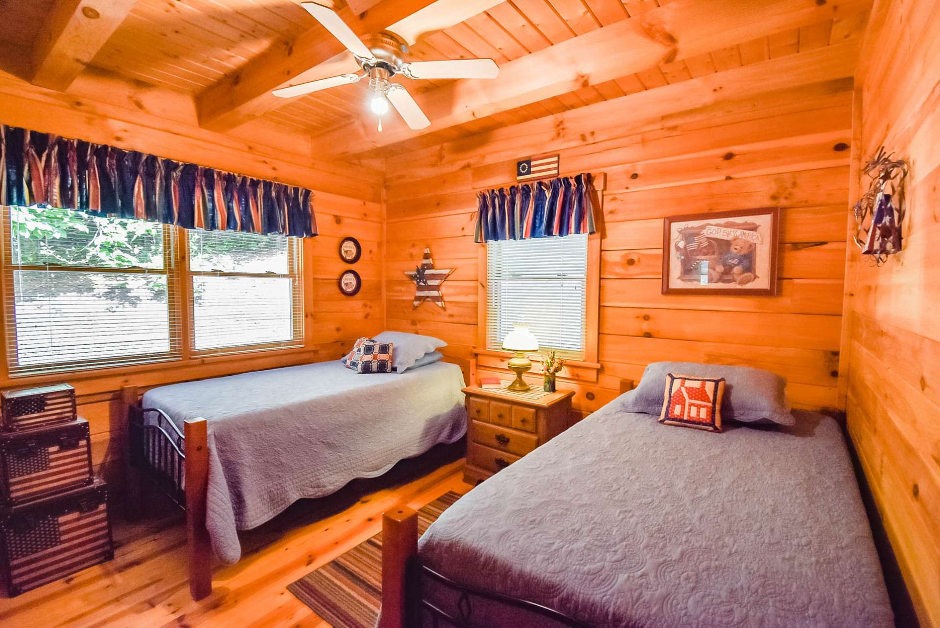 Both main level bedrooms are generously sized and feature exposed beam ceilings.