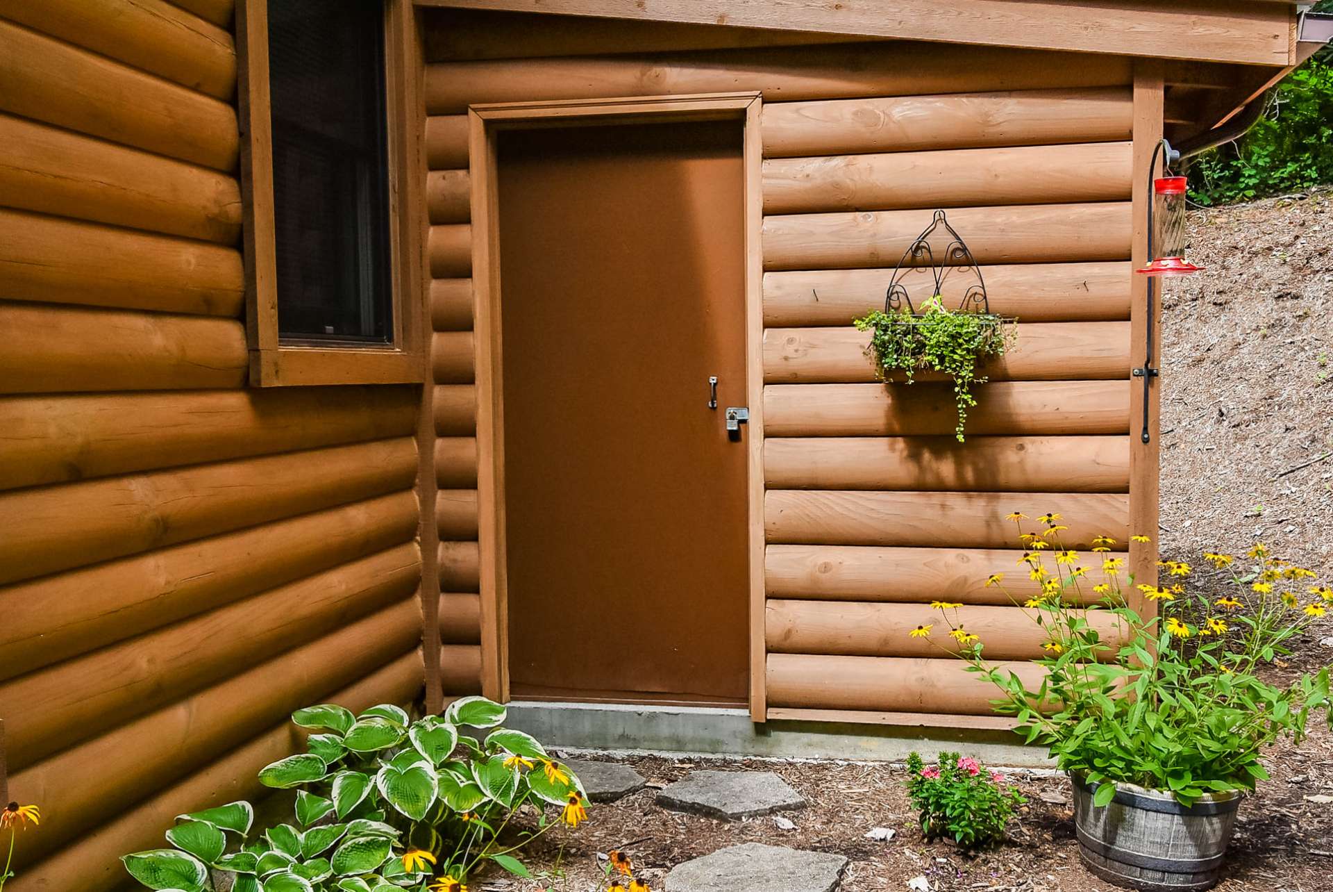Additional storage space is provided by an attached shed, perfect for your landscaping tools.