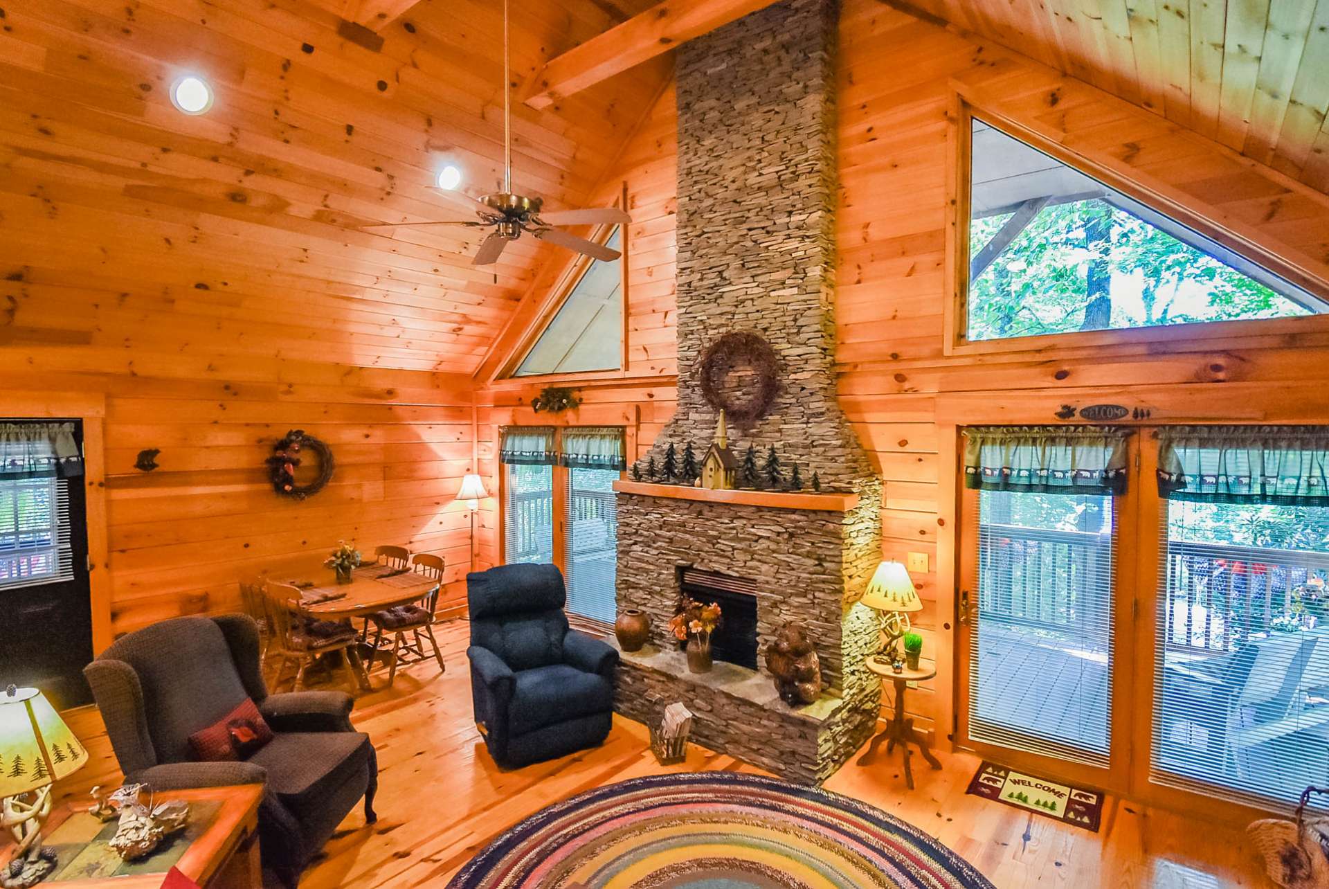 A wall of windows in the great room fills the cabin with natural light and allows you to enjoy the outdoor scenery throughout all four seasons here in the mountains.