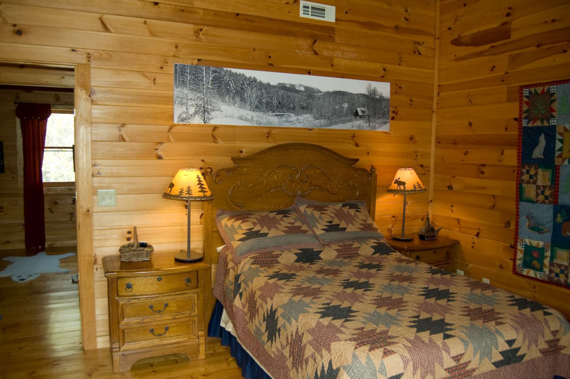 This upper level bedroom features a private balcony to enjoy the views.