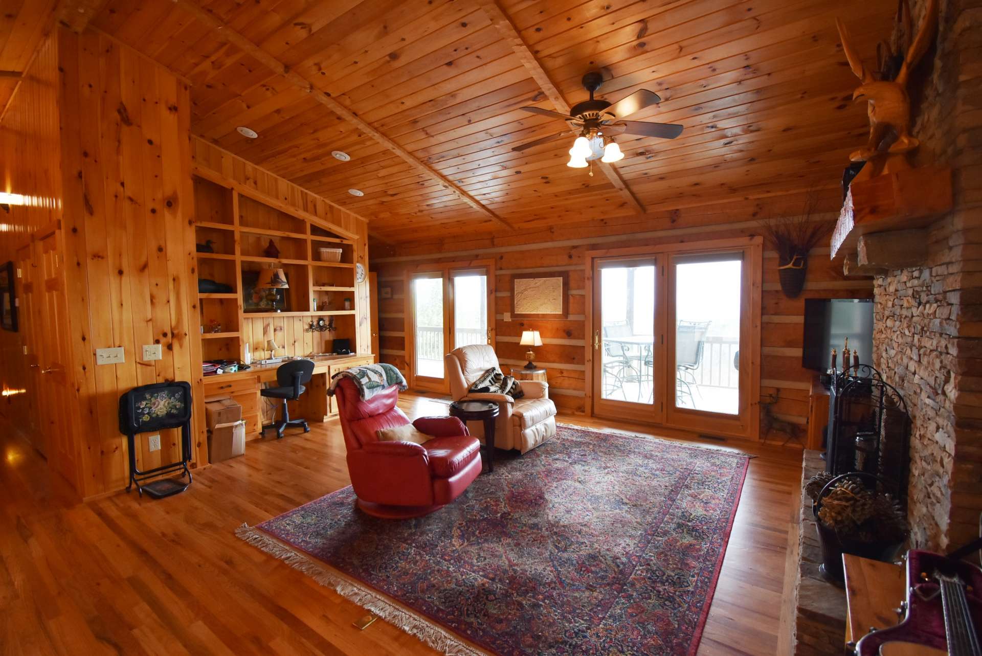 The living area of the great room also offers easy access to the deck and outdoors  when entertaining.