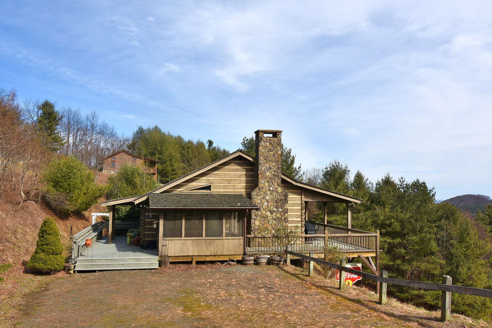 Offered at $359,900, this  NC log cabin  with long range Blue Ridge Parkway views is located in  the Cannon Acres community off of Thistle Hill Lane.   If you are looking for a log cabin  retreat or primary residence in the North Carolina Mountains, call for more information on listing B166.