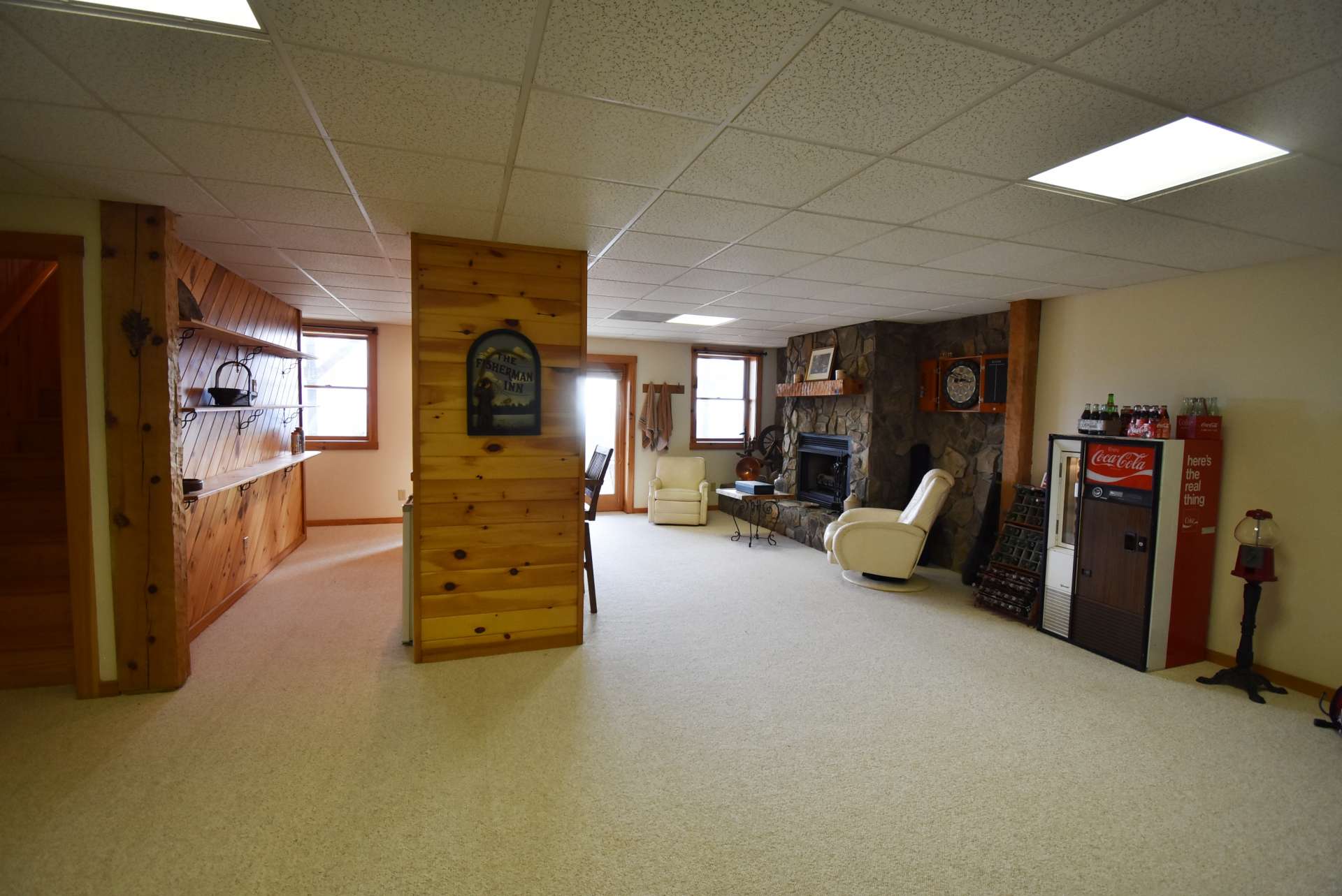 There is plenty of room to add a theater area or pool table, or both.  The laundry area is on this level, as well as  the third full bath and a one car garage.